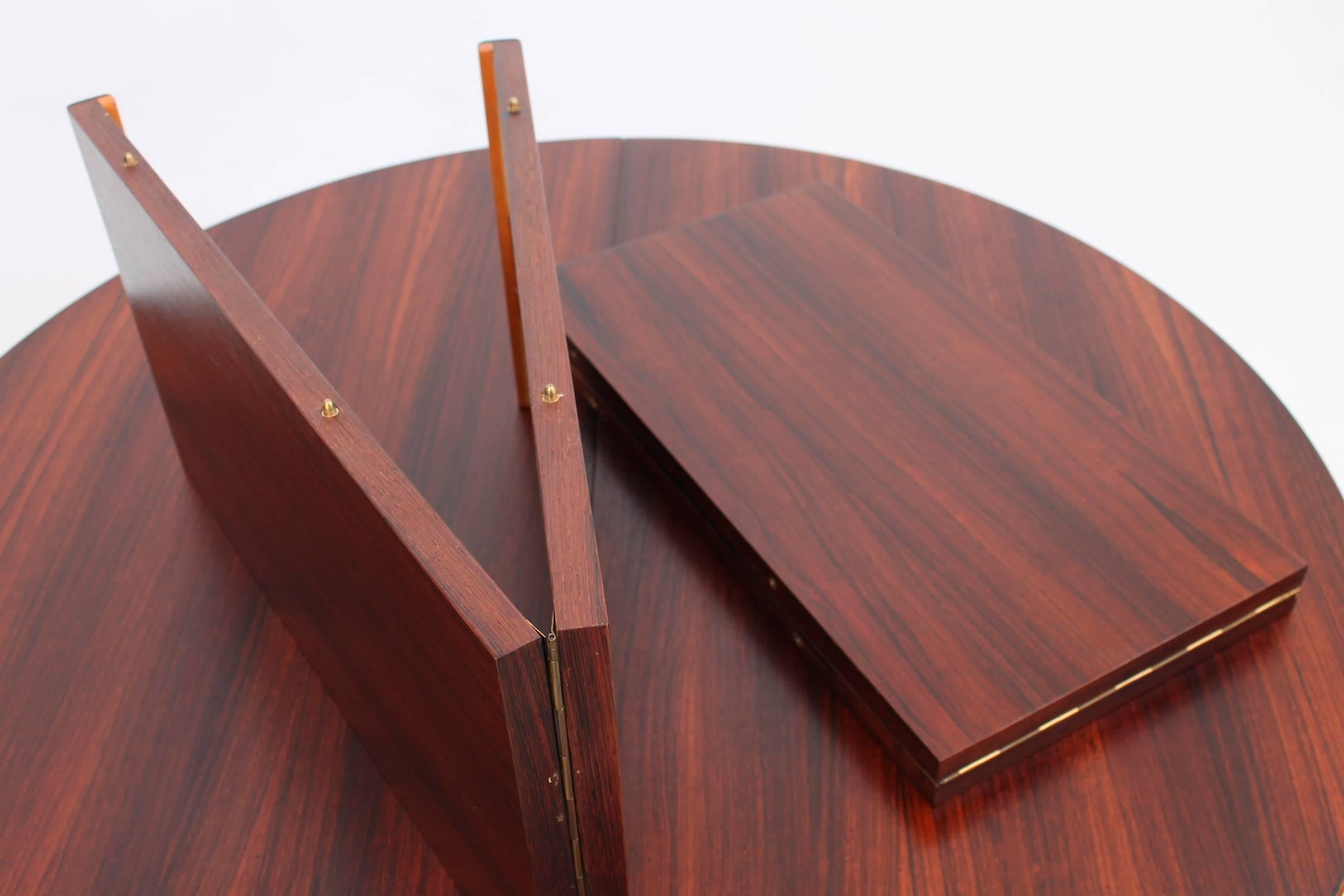 Danish Circular Rosewood Dining Table with Self Storing Leaves, Scandinavian Modern For Sale