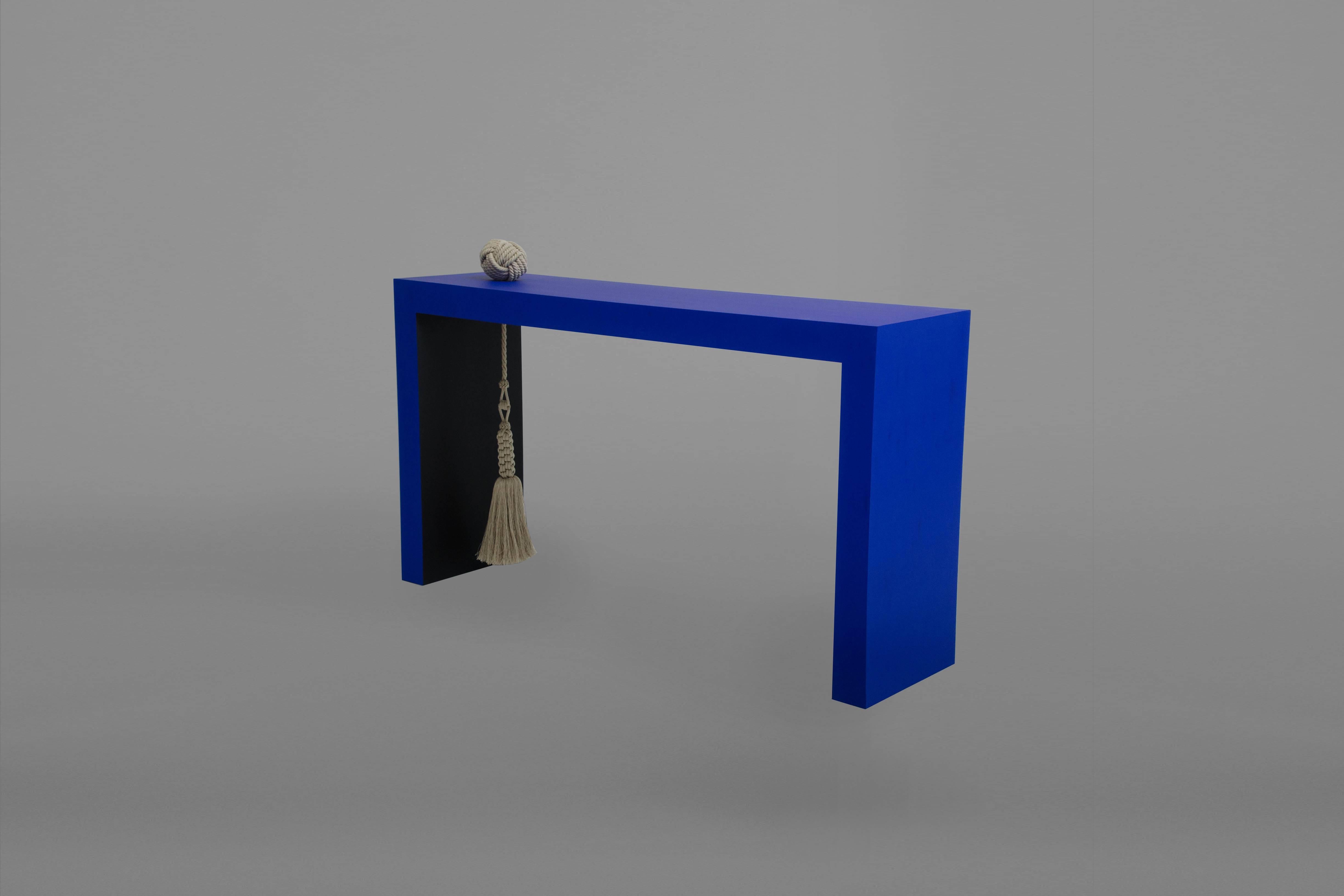 Wood console painted with matte finish (Yves Klein blue and black) with custom linen tassel and knot, by Kelly Behun Studio. 
Measures: 54” W x 14” D x 30” H.
Made to order.
Lead time 12-14 weeks.
Custom sizes and paint finishes available upon