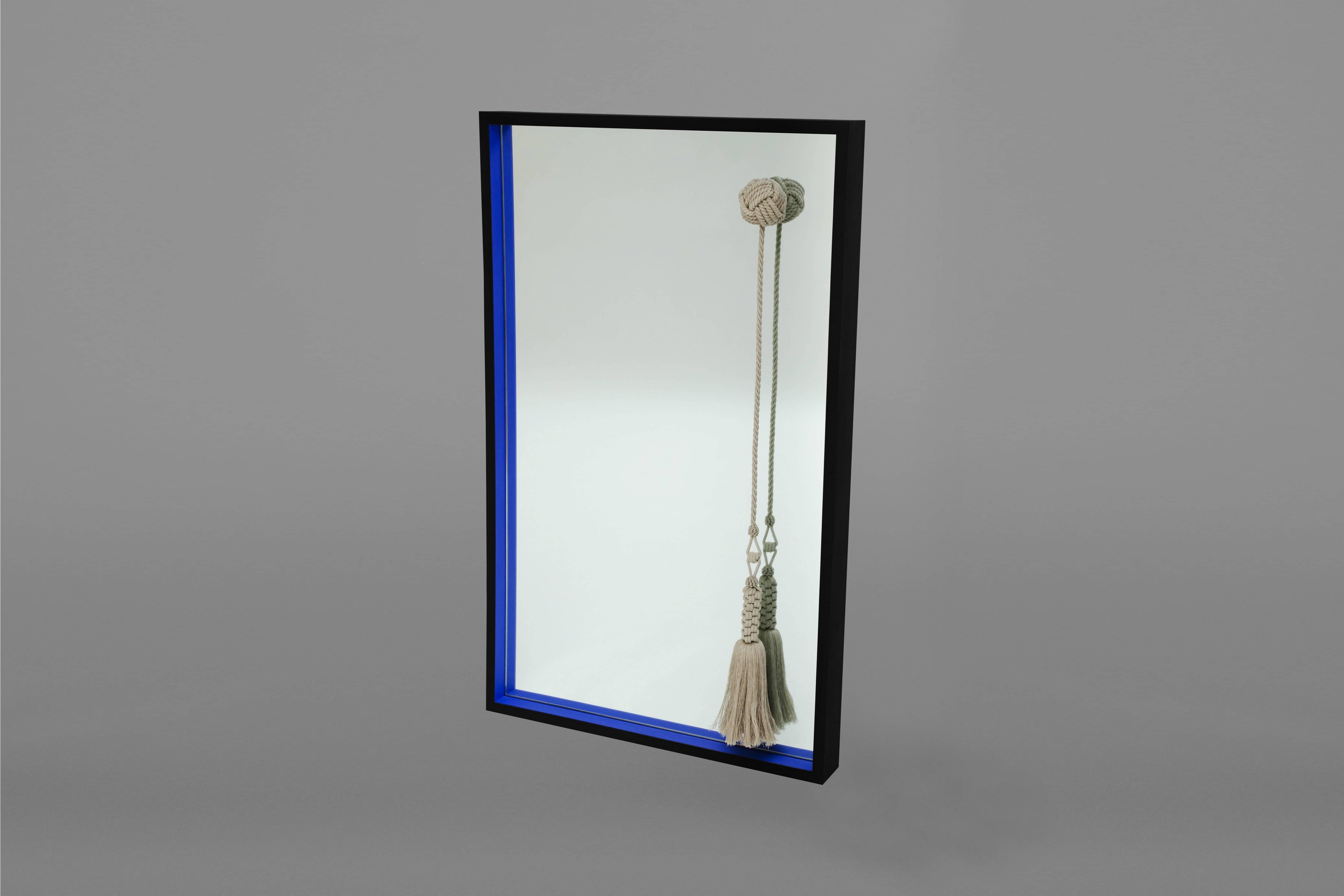 Custom mirror with painted matte finish wood frame (Yves Klein blue and black) with custom linen knot and tassel by Kelly Behun Studio. 
Measures: 33” W x 54” H x 4” D.
Made to order.
Lead time 12-14 weeks.
Custom sizes and paint finishes available