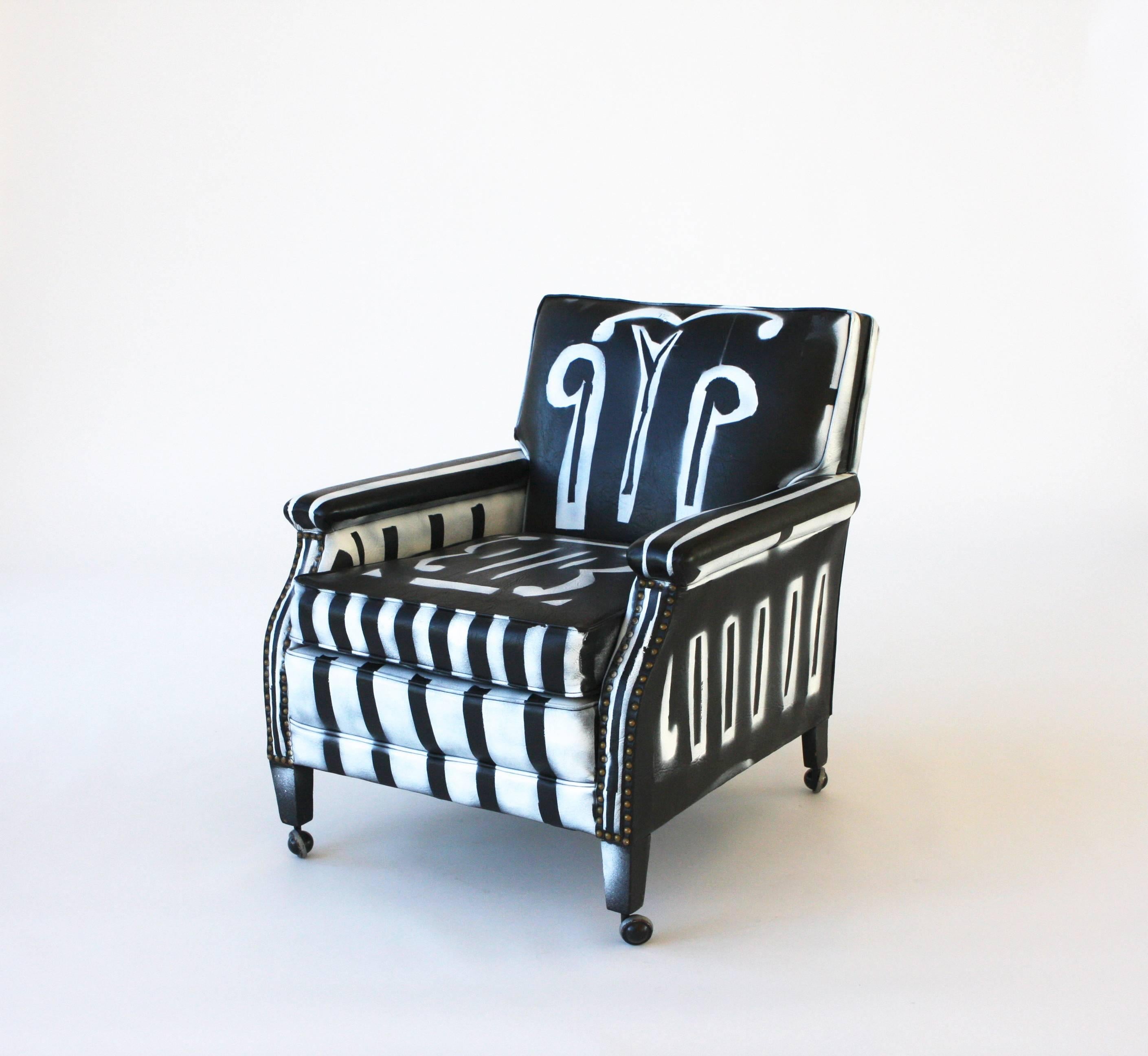 Vintage club chair on casters, black faux leather, hand painted by artist Kim MacConnel.

Kim MaConnel is a southern California based artist who was influential in the seminal Pattern and Decoration Movement of the 1970s and 80s which sought to