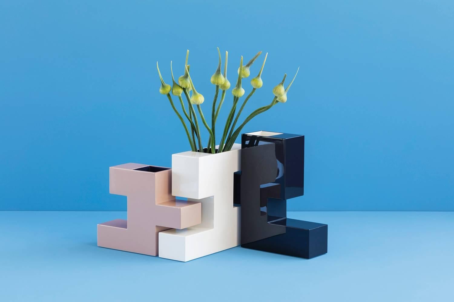 A set of three watertight, lacquer vases that fit together like a puzzle.
Can be sold as a set or separately.
Measures: 
Dark grey vase with cream interior: 12