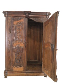 French 18th Century Carved Oak/Walnut Armoire with Mask and Cartouches
