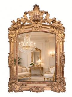 Carved and Gilded Baroque Mirror with Floral Crest, 18th Century