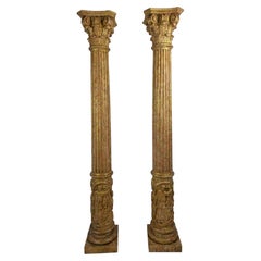 Pair of Carved and Gilded Wooden Columns with Figural Bases, circa 1920