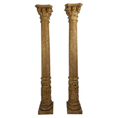 Pair of Carved and Gilded Wooden Columns with Figural Bases, circa 1920