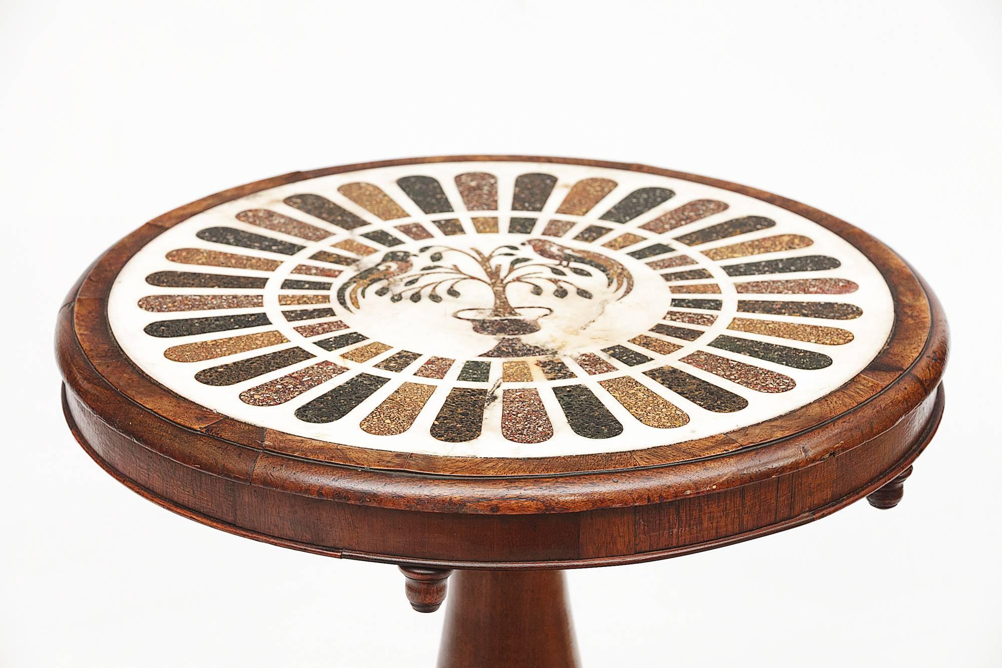 Early 19th century George III marble-top inlaid mahogany table, with stone mosaic depicting two birds in a tree, above turned central pillar on tripod base with paw feet.
