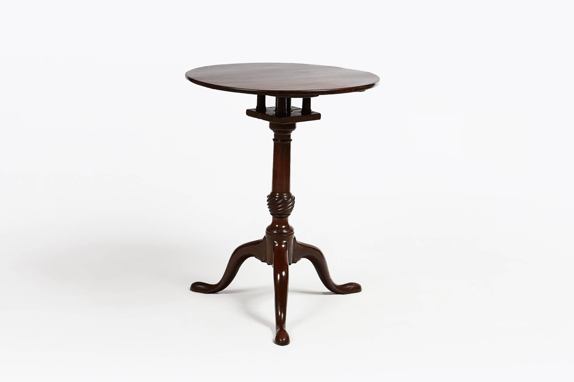 18th century George III mahogany bird cage tip-up table, sits on a spiral carved column and cabriole tripod leg, circa 1780.