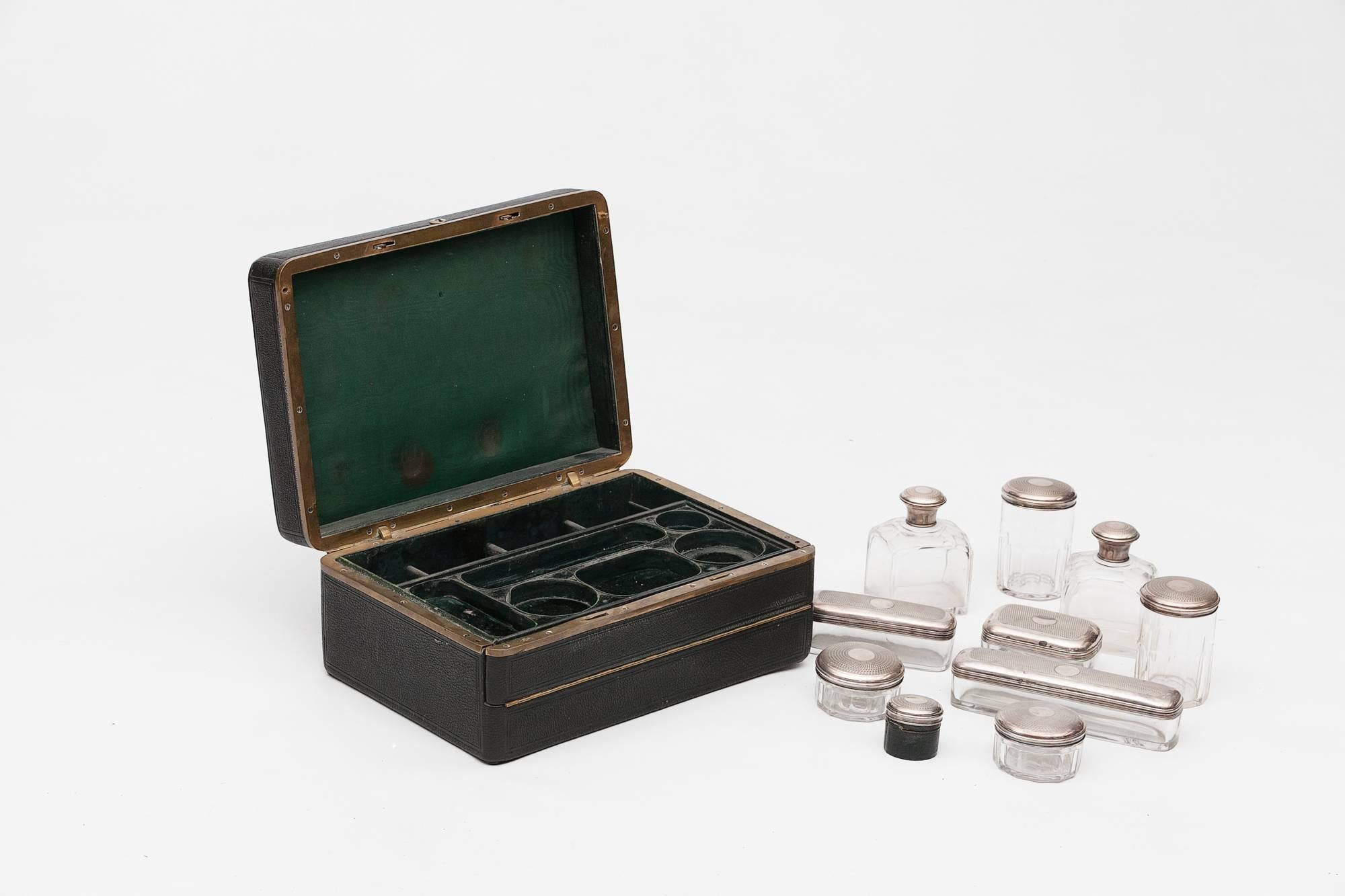 19th century pigskin and silver plated gentleman’s dressing case, fitted silver topped glass toiletries container and lined with green silk. Fall front allowing upper section to slide forward revealing jewelry / dress stud case below. ‘French made’.
