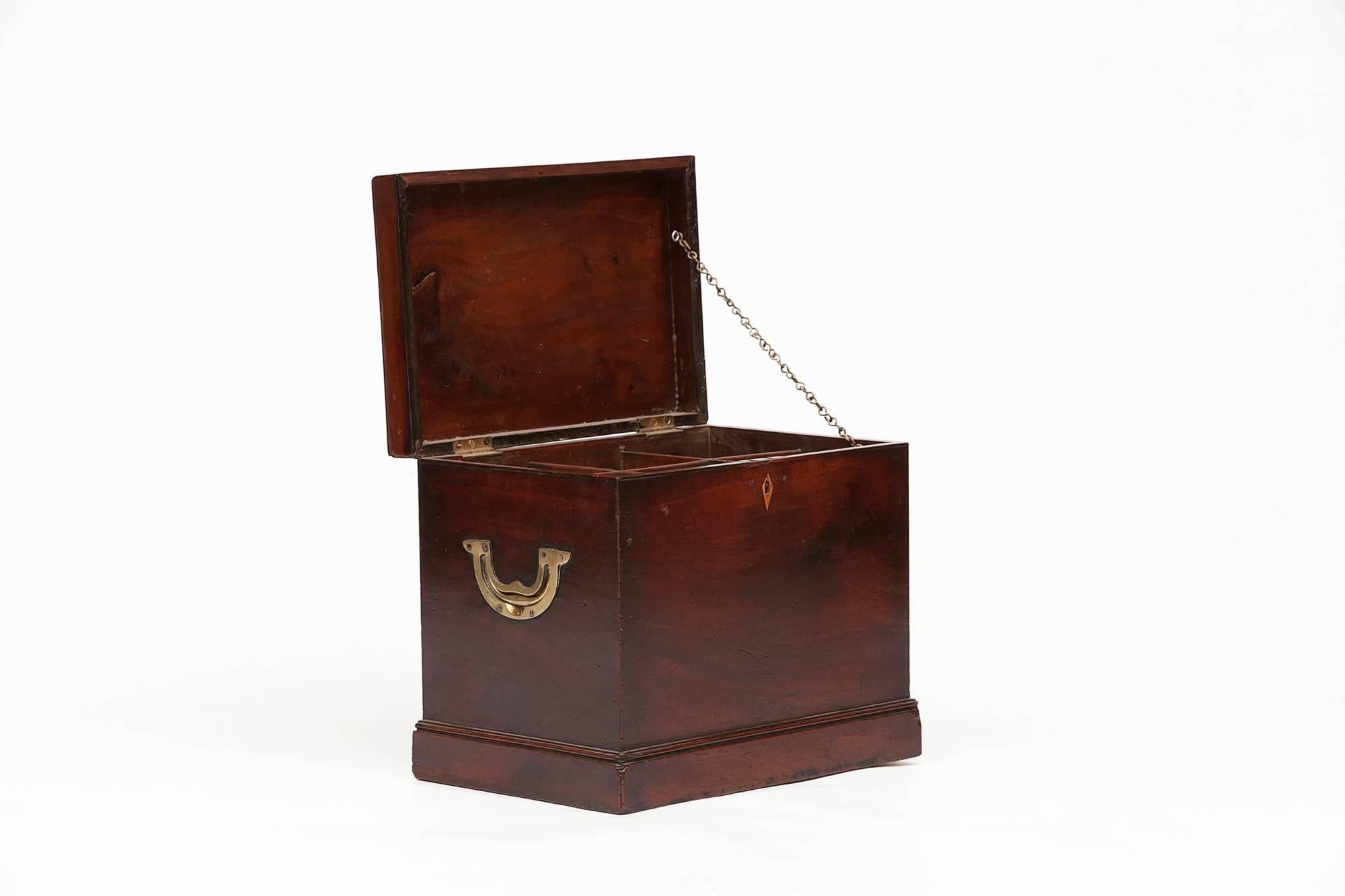 Georgian mahogany decanter holder complete with a set of six decanters, hinged plain lid enclosing fitted interior with brass handles on the side.
  