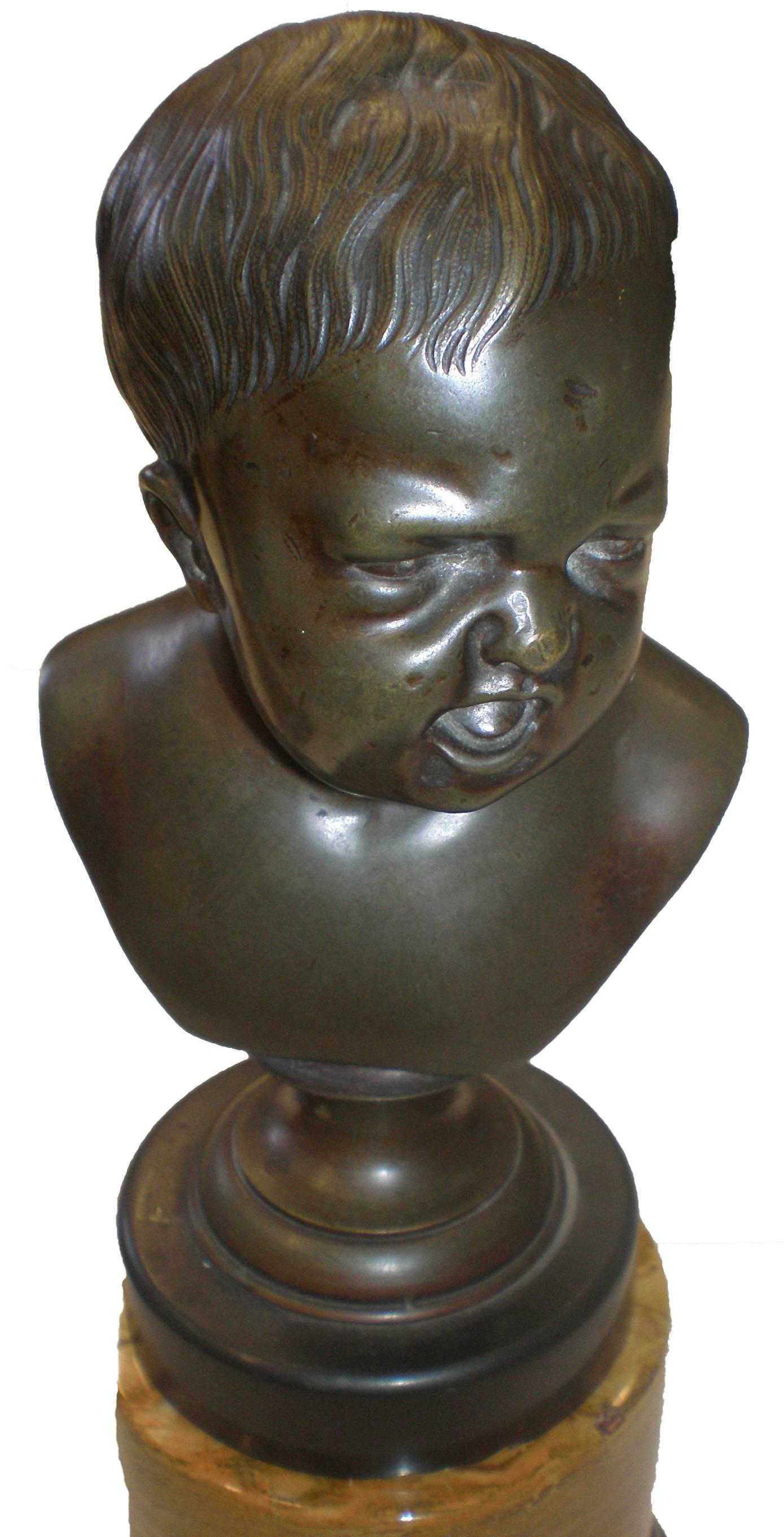 19th century pair of bronze sculptures after Franz Xaver Messerschmidt (1736-1793) tabletop busts of crying baby and laughing baby on marble plinths.