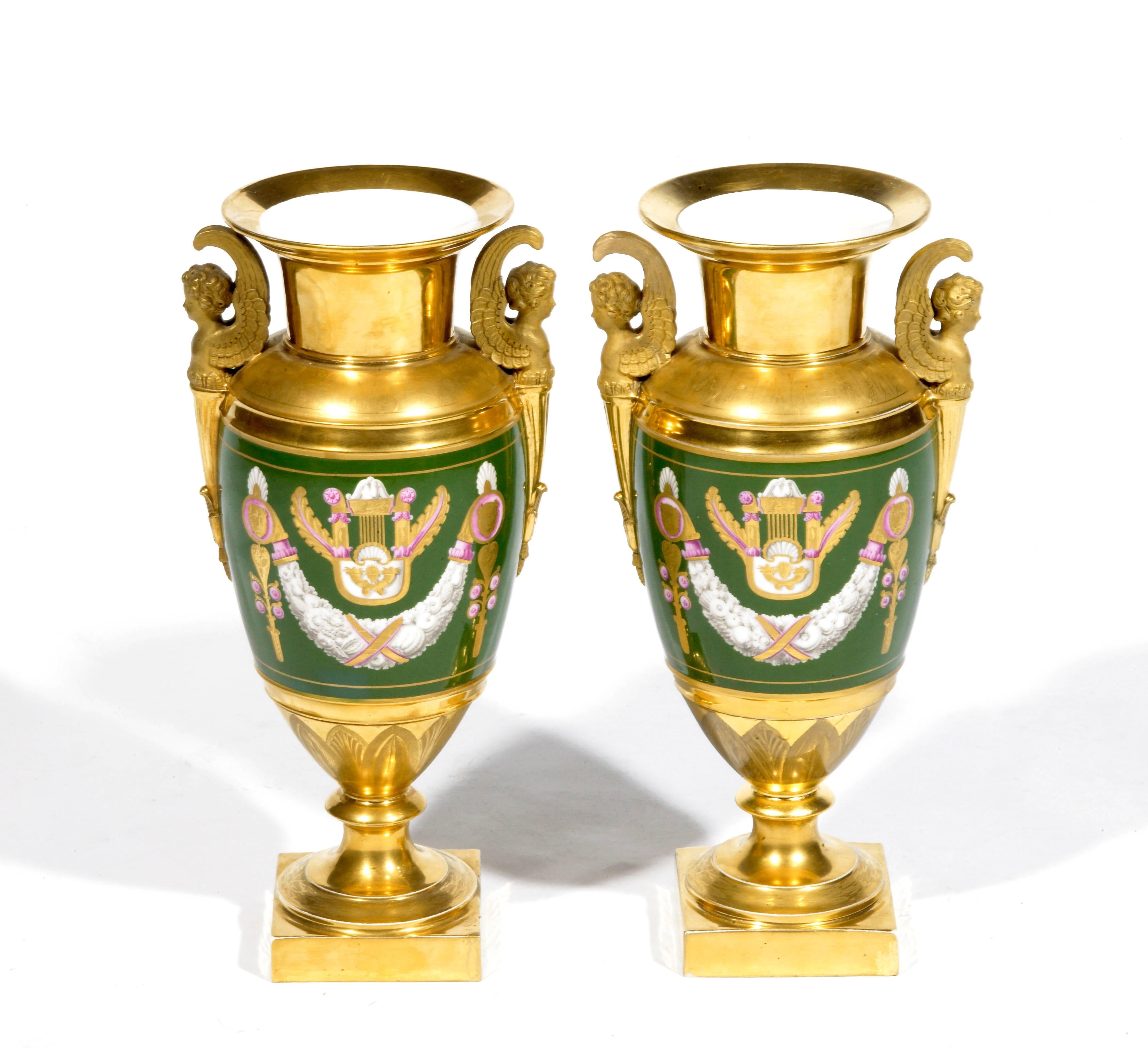 19th century pair of Paris porcelain vases of gilt and green glaze depicting classical scenes. Inscribed with ‘F’ mark on the base.