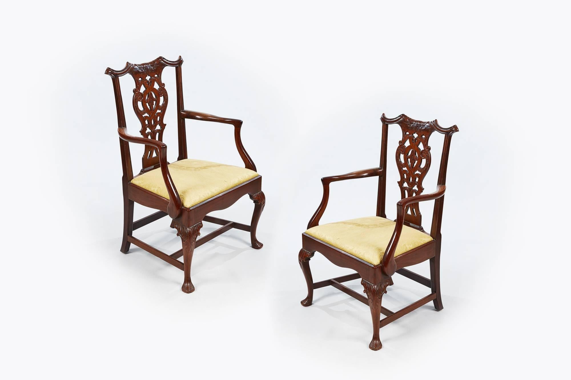 19th century set of eight (two carvers and six singles) Chippendale style dining chairs with finely carved back splat with gold upholstered drop in cushioned seat supported on cabriole leg with acanthus carving on knee terminating on carved strap