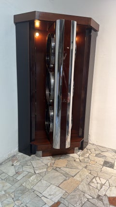 Willy Rizzo, a rare swiveling corner bar cabinet in walnut and chrome-plated steel