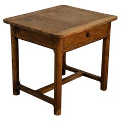 19th-century low walnut table with X-shaped stretcher base