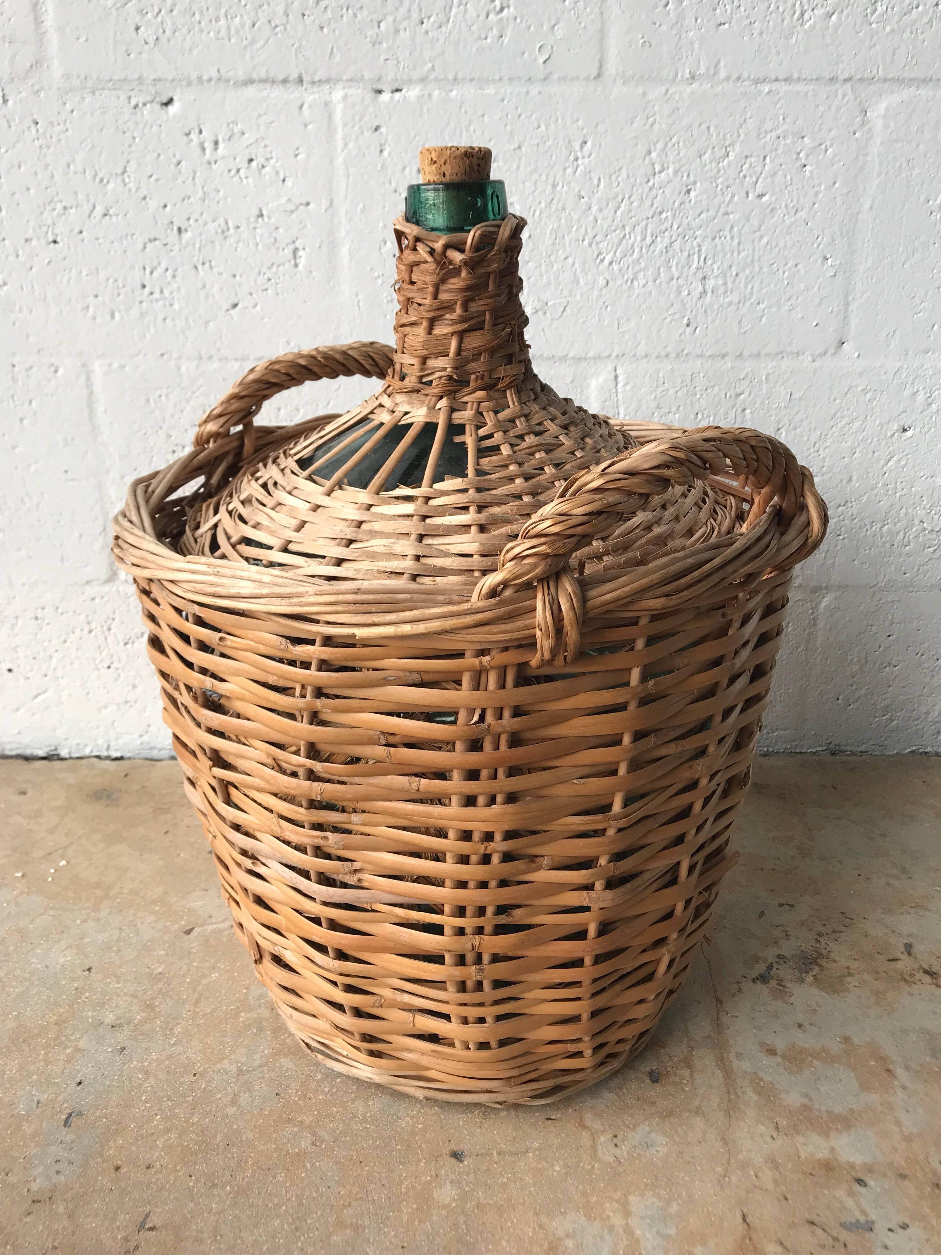 Midcentury 20 liter French wicker basket demijohn bottle by Viresa, France, circa 1950s.