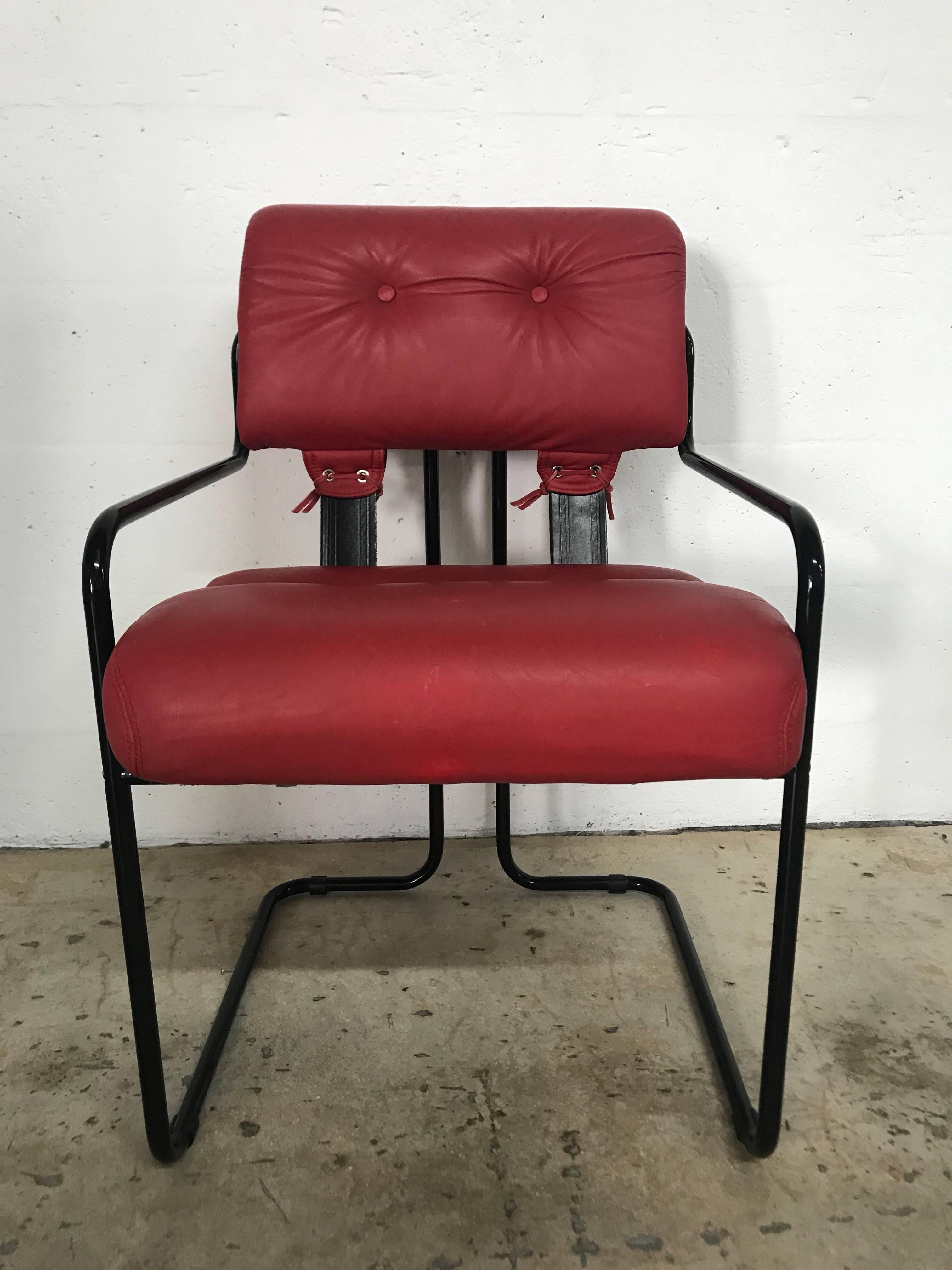 Rare black enameled dining chairs with red leather seats and back designed by Guido Faleschini for Pace Collection and manufactured by i4 Mariani in Italy.