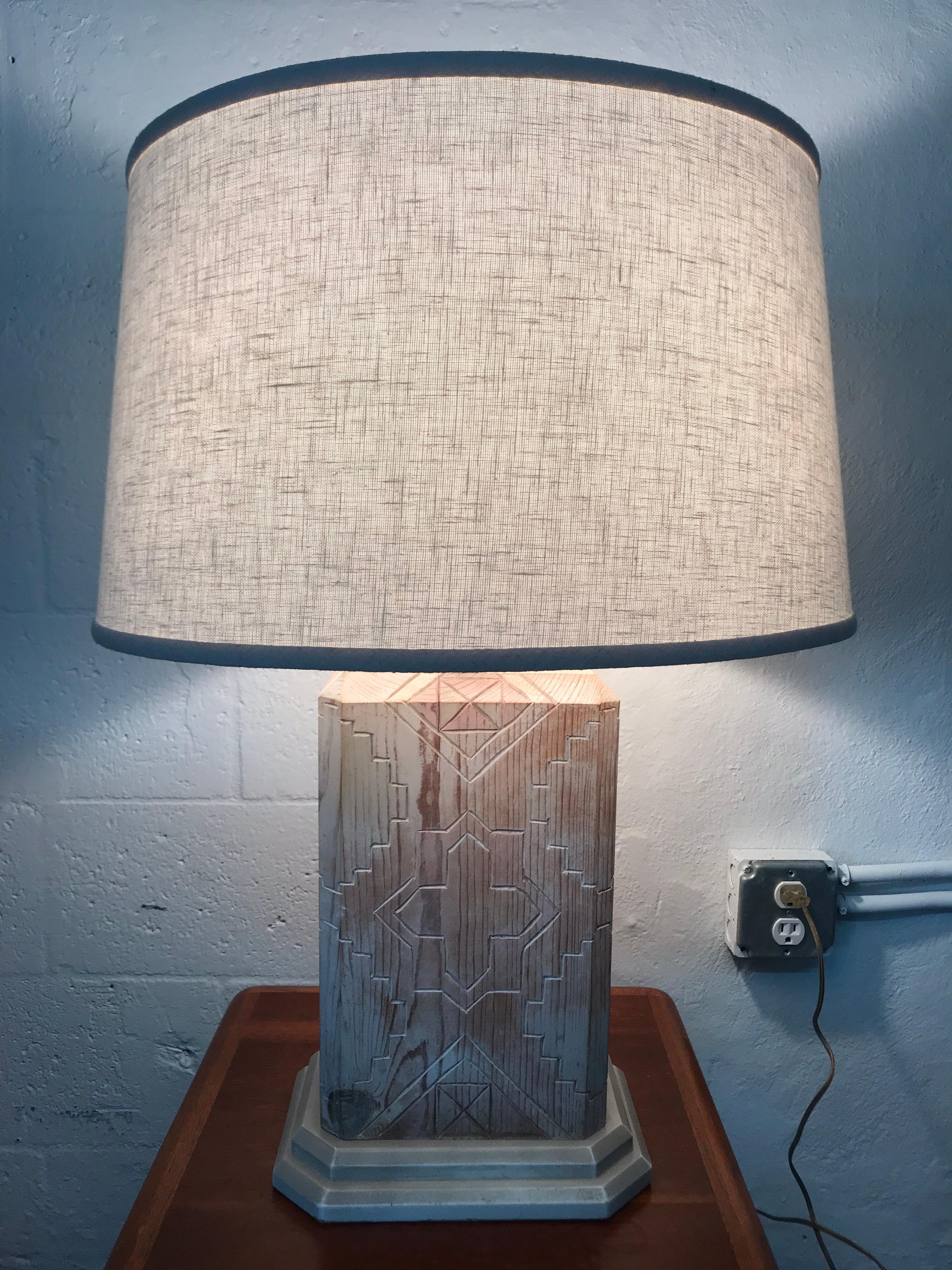 Table lamp with a south western geometric Santa Fe, New Mexico motif rendered in perused white washed oak by Sarreid LTD., 1983.

Shade for display purposes only.