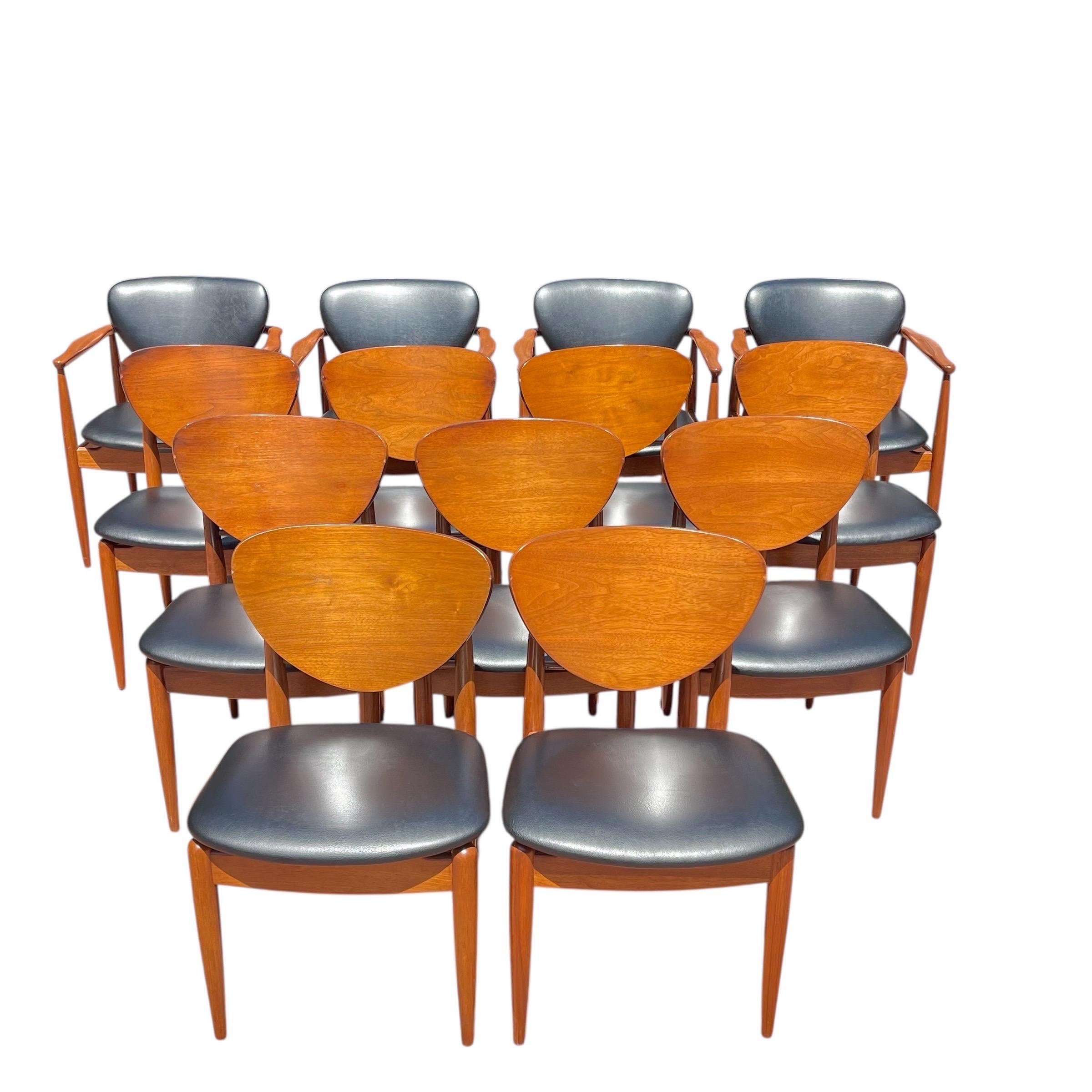 Set of 14 Danish Midcentury Modern Dining Chairs.  This set includes 4 armchairs and 10 side chairs.  The chairs are rendered in polished walnut turned frames with the 4 armchairs having black leather seats and backs and the 10 side chairs having