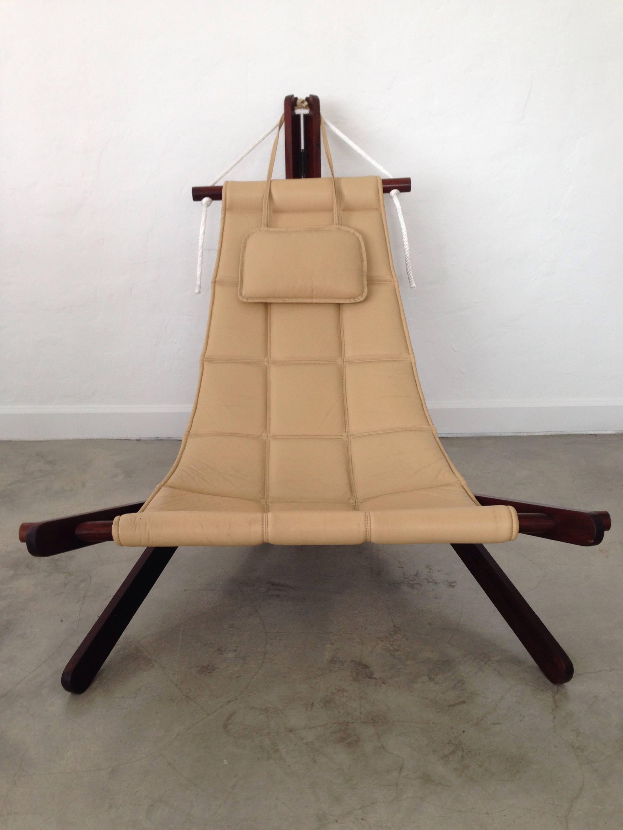 Rare and collectible sling chair in Cherry (Jatoba) wood, cream leather and rope by British architect Dominic Michaelis for Moveis Corazza, Brazil.