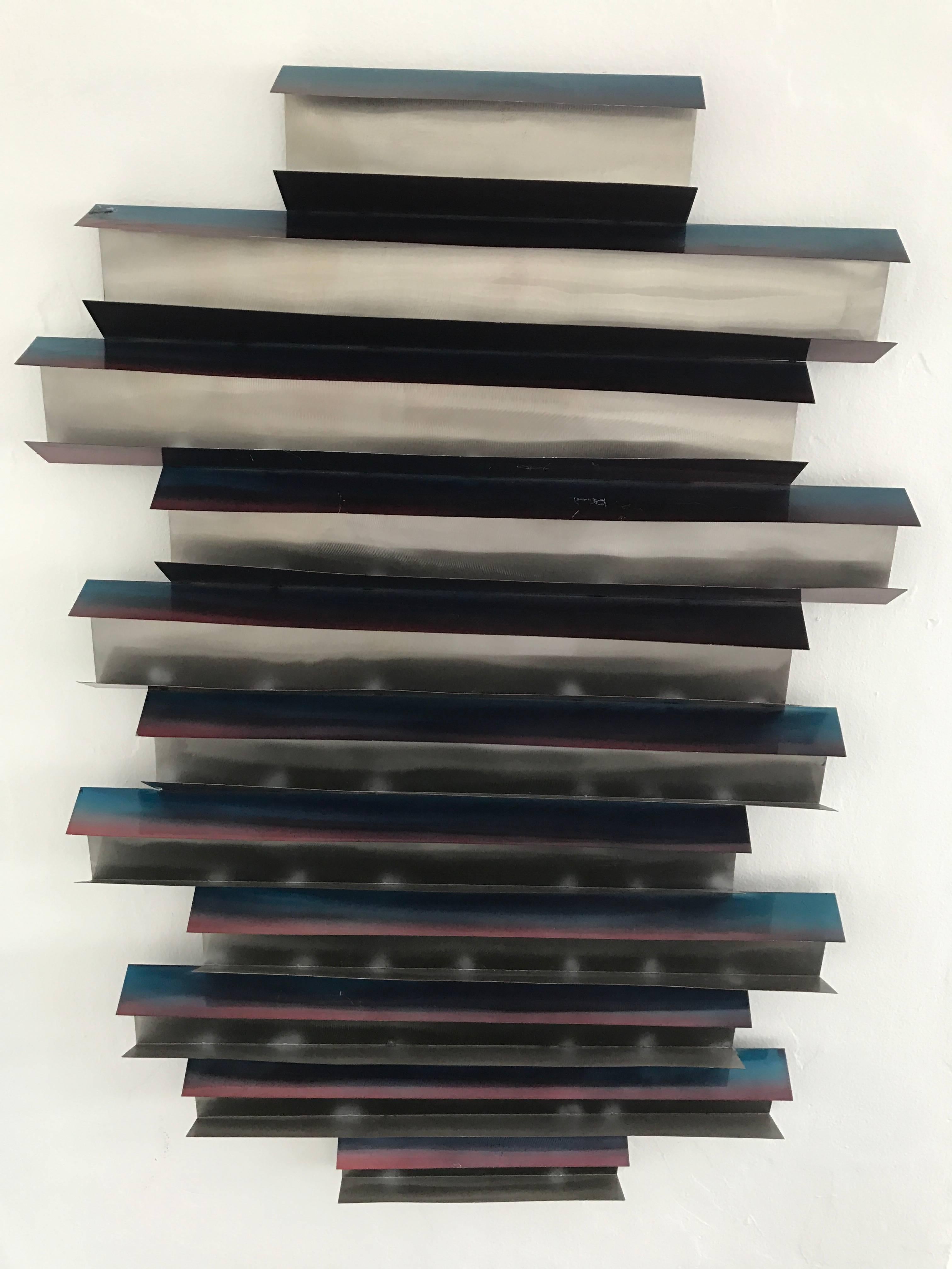Folded steel wall sculptures with pink and blue highlights by C. Jere 2007, signed. Can hang vertical or horizontal.
