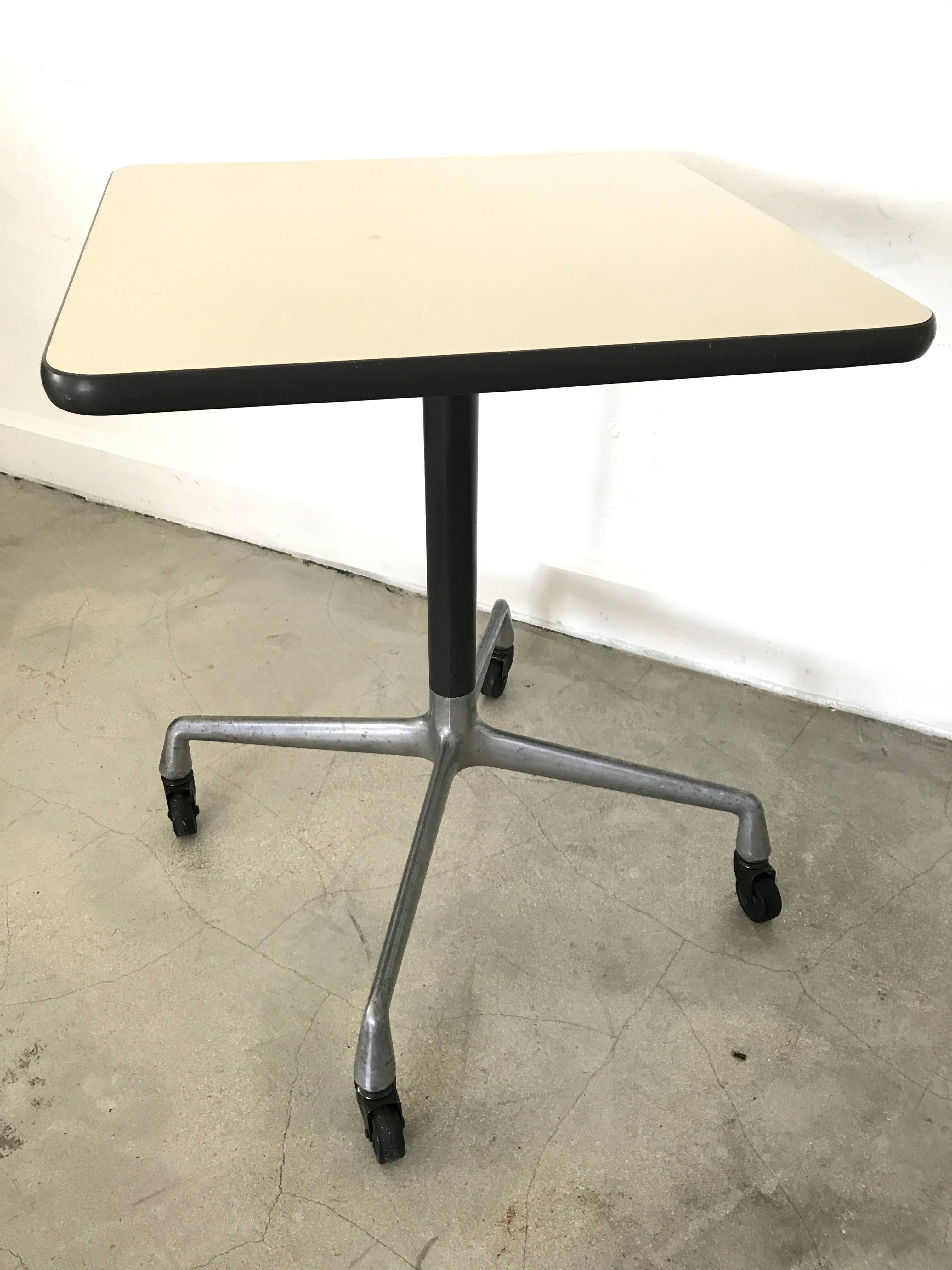 Charles and Ray Eames Aluminium Group design rolling side or occasional table with casters for Herman Miller.