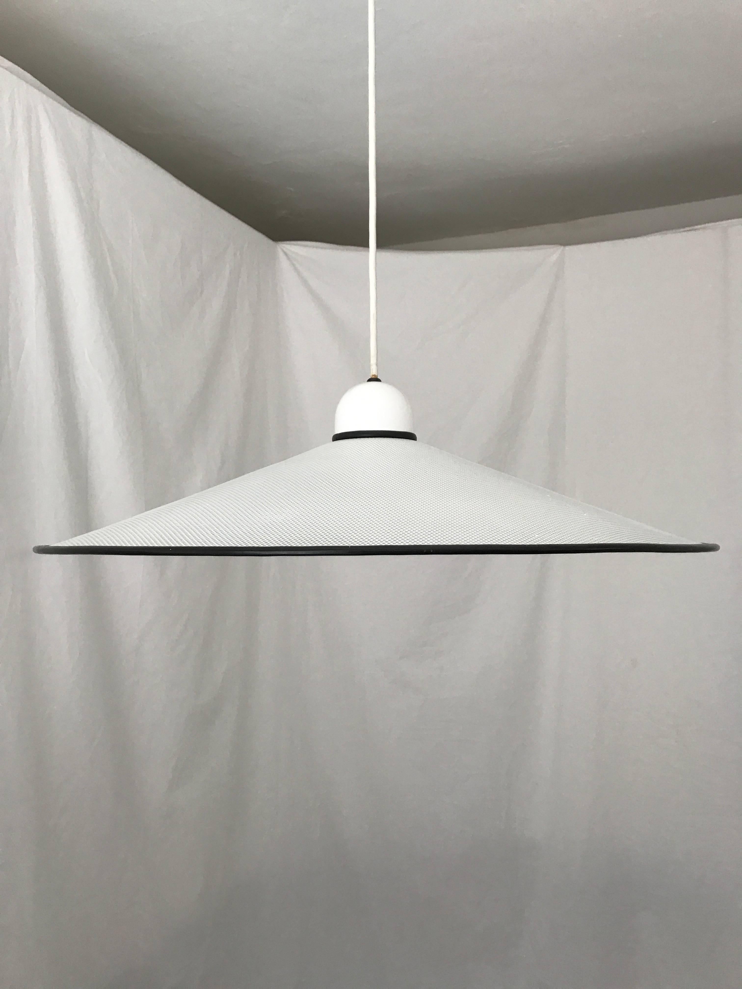 White and black pendant lamp with perforated shade by Ron Rezek. Height is adjustable up to 37 inches.