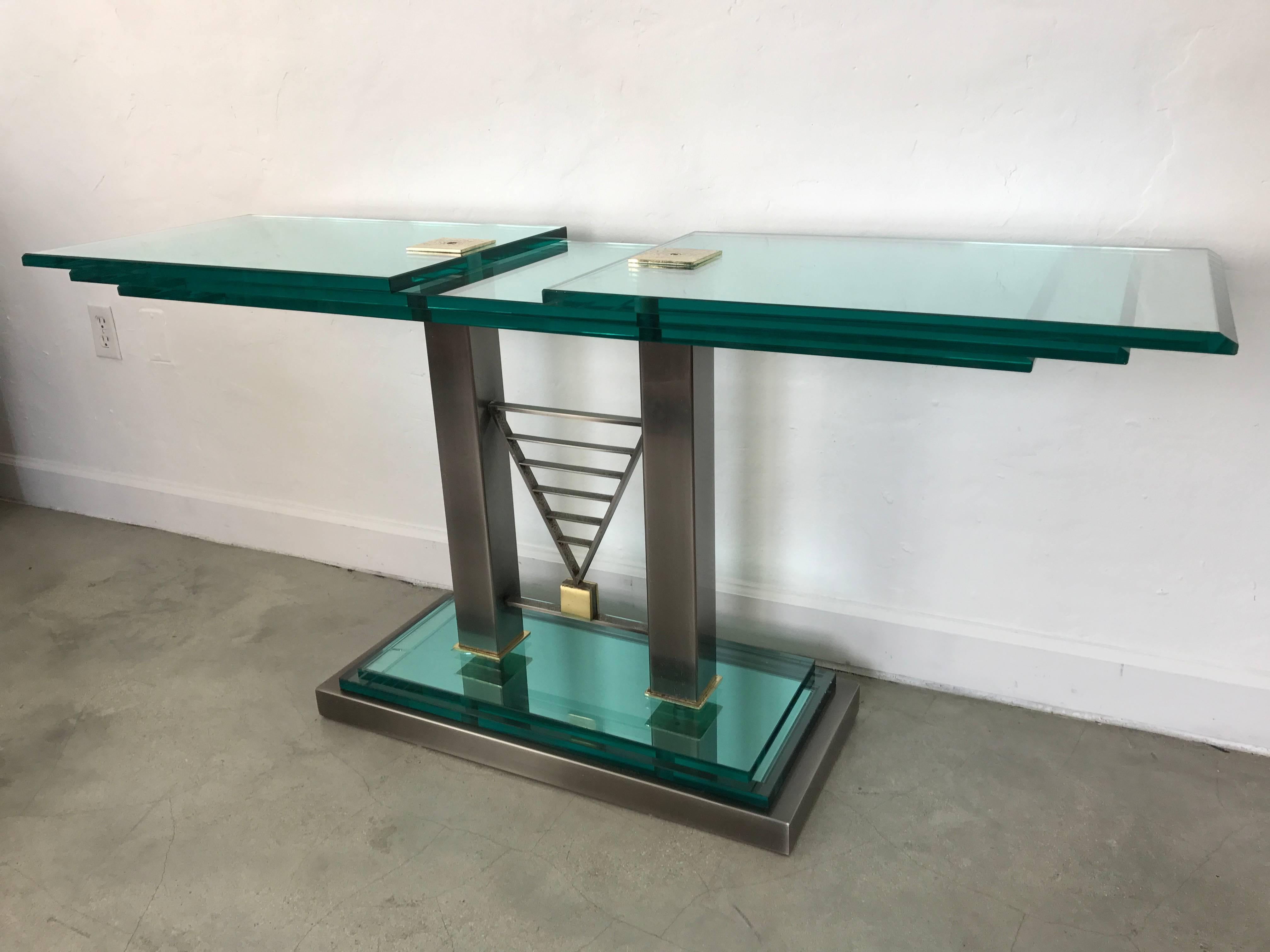 Original steel and bevelled glass Deco Revival console table with patinated brass hardware by Design Institute of America, 1986.