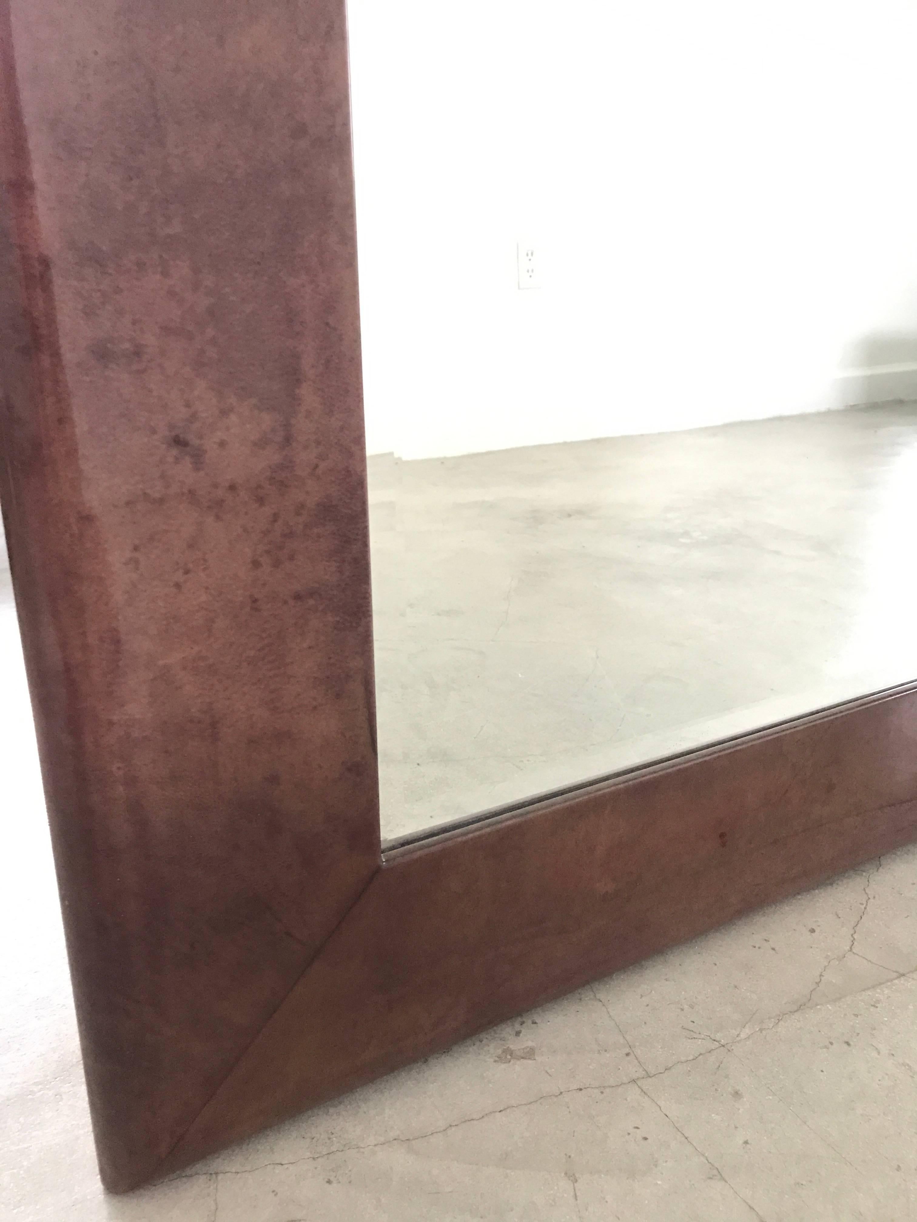 Purple tinted goatskin wall mirror by Aldo Tura.

Two mirrors available.