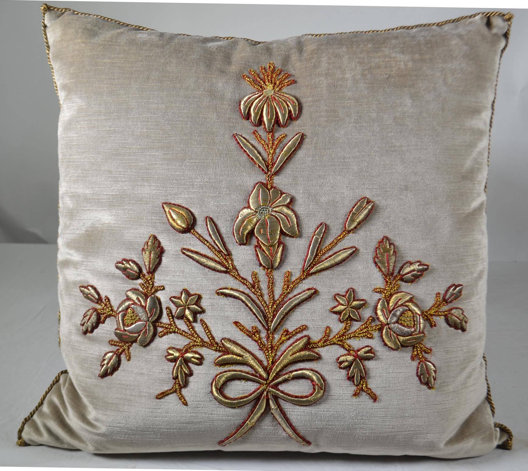 Pair of antique European raised gold metallic embroidery, couched with red silk thread on silver velvet. Hand-trimmed with gold metallic cording knotted in the corners, down filled.