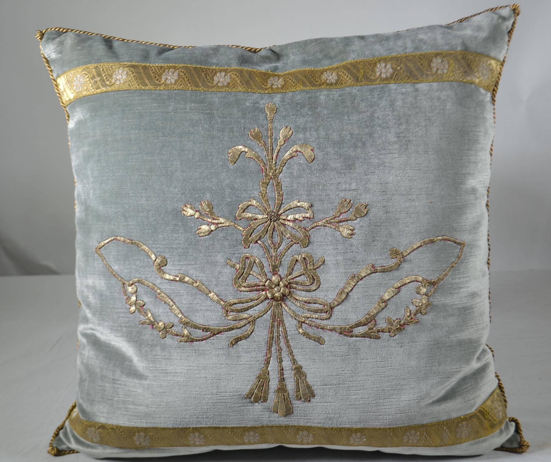 Antique Ottoman Empire raised gold metallic embroidery border with special antique gold metallic gallon with silver flowers on pale French blue velvet. Hand trimmed with vintage gold metallic cording, knotted in the corners. Down filled.