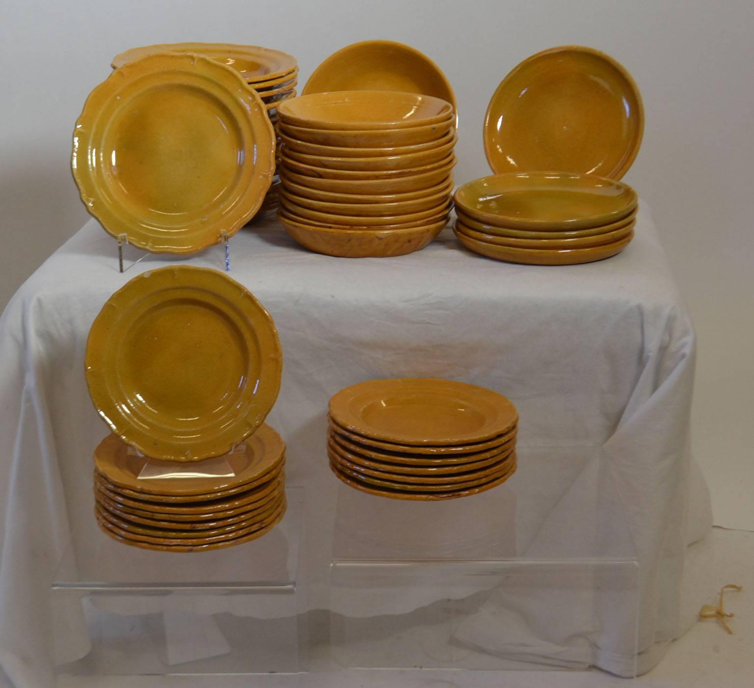 Turn of the century (circa 1900) Faience pottery tableware (56 Pieces), from the Drome area of France. Serving set (12 pieces) sold separately.

*Serving bowls three.
*Misc. sized oval serving plates (5)
*Small serving bowls two.
*One round