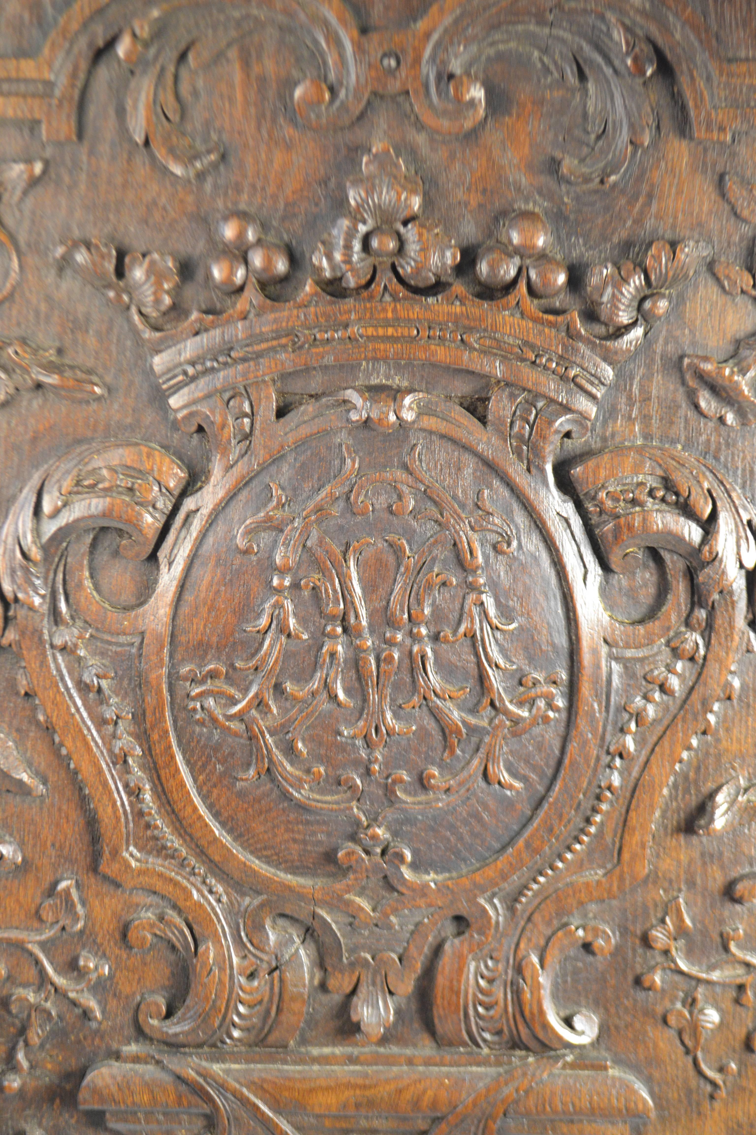 Carved Wood Panel, Circa 1740 with central Coat of Arms and acanthus leaf and floral motif.