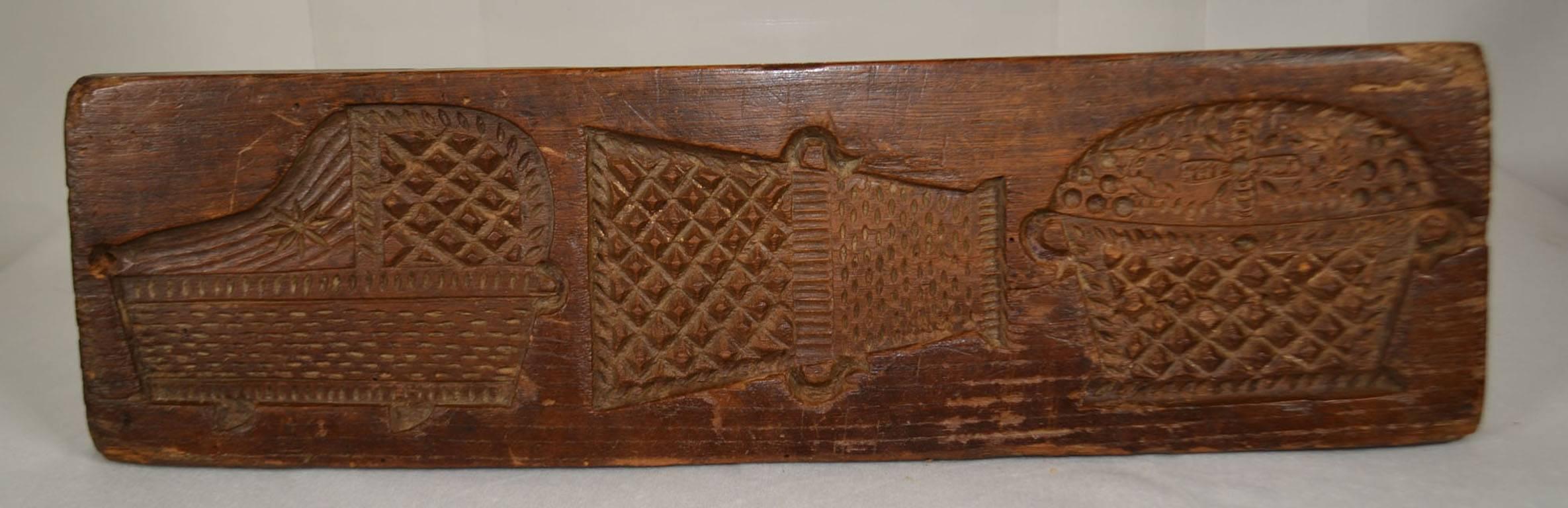 Double Sided Wooden Gingerbread Mold (Man, Woman, Deer, Monkey pushing cart) other side (two baskets and a bassinet)
Circa 1860-80 Signed (see picture)