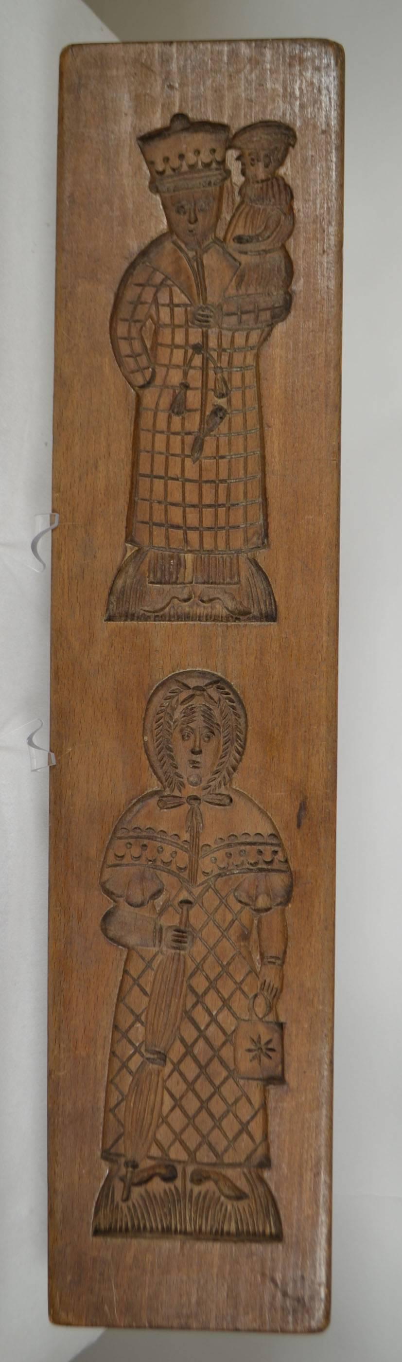 Double-sided wooden gingerbread mold, (man and woman) both sides.