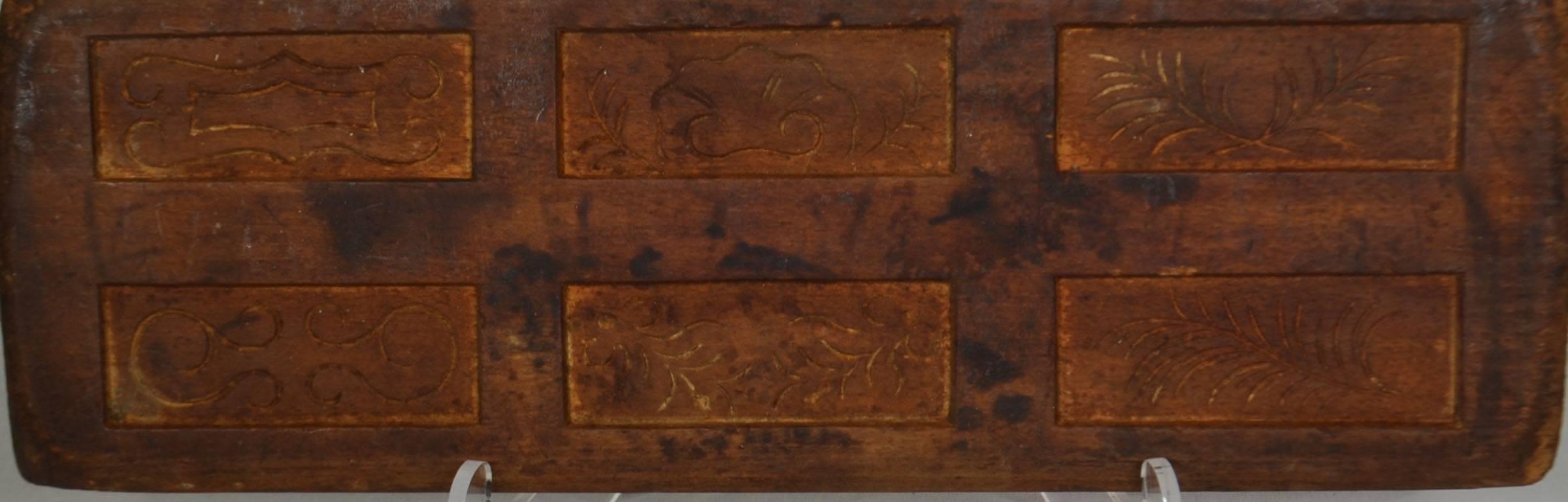 Wooden gingerbread mold (rectangle shapes with simple designs).