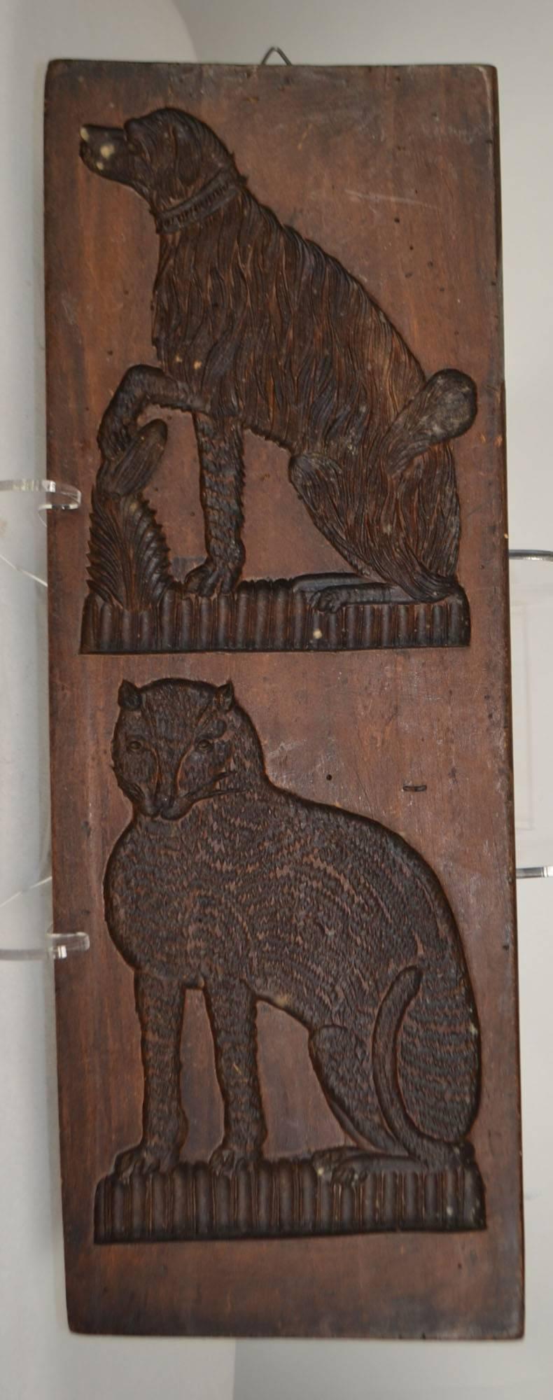 Wooden gingerbread mold, dog and cat.