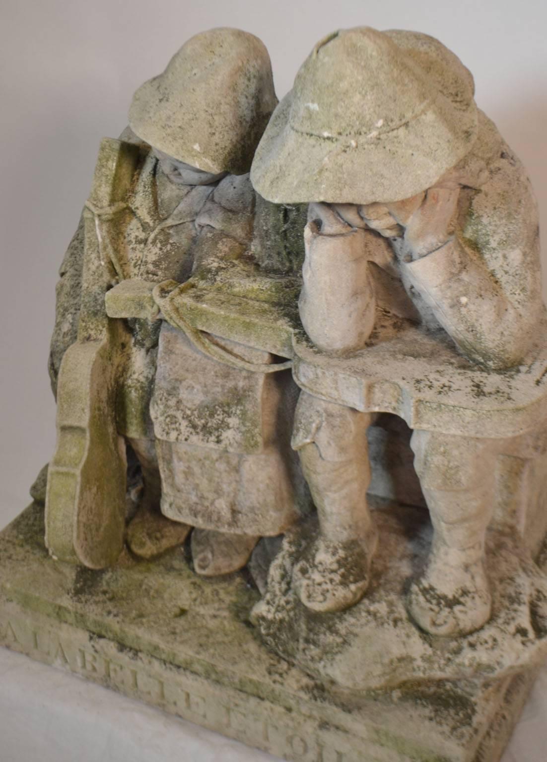 Carved stone statue of children with musical instruments, circa 1900-1920.