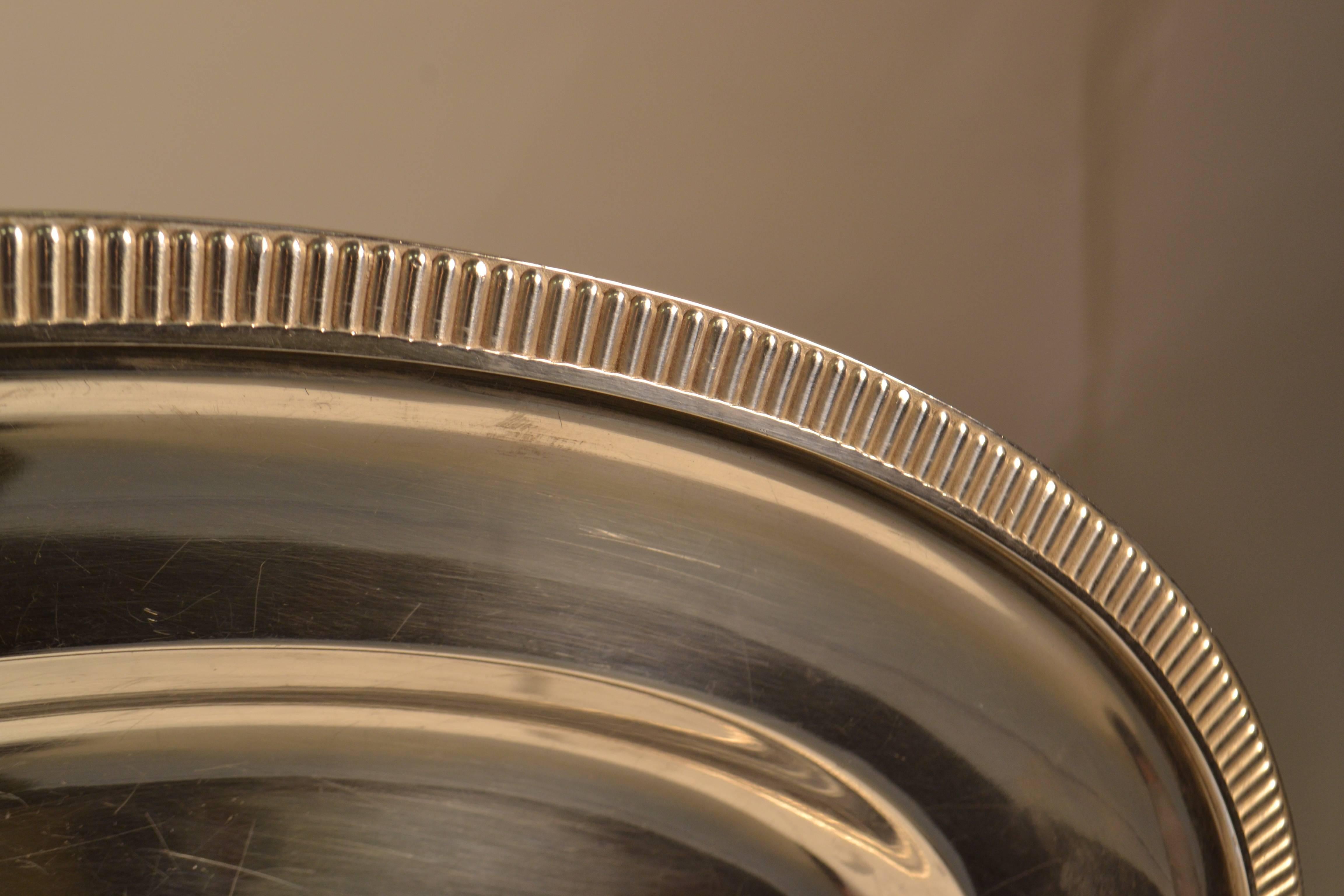 Fine silver plated round serving tray. The company was founded in 1867 by Adrien Céleste Pillon (Ercuis is the name of a little village of the Oise). After his bankruptcy in 1870, the venture was revived by George Maës, a glass cutter in Clichy.
