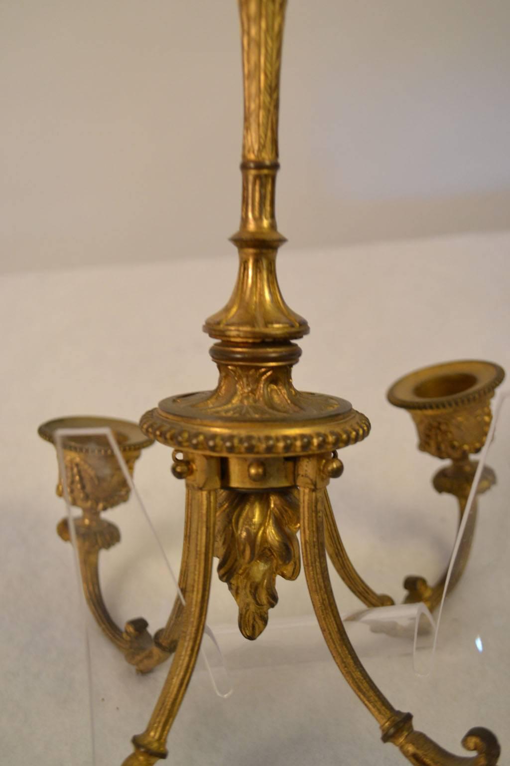 Small hanging bronze light fixture in Louis XVI style.