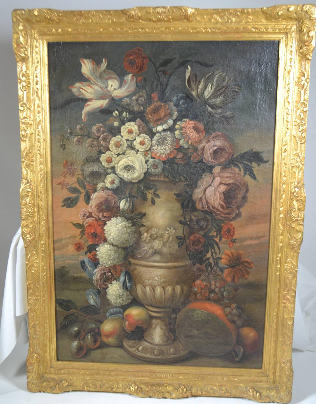 18th century framed flower painting of cascading flowers in an urn surrounded by fruit, oil on canvas, circa 1760-1780.