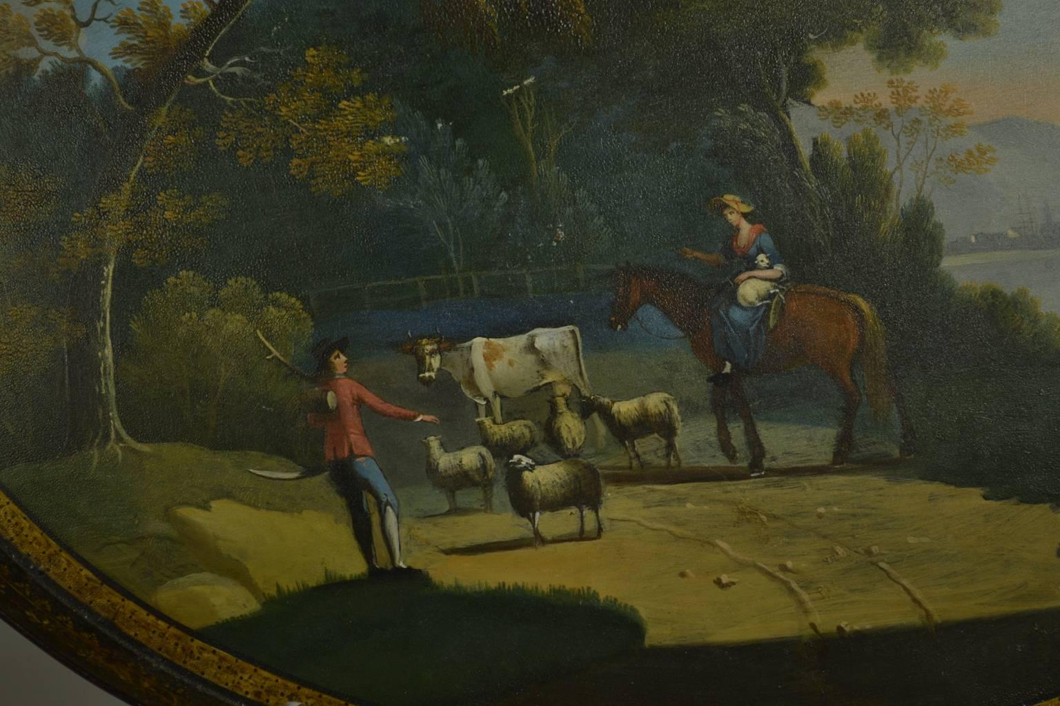 A Georgian Tole Peinte oval gallery tray 18th century, depicting a reserve pastoral scene beside the sea.