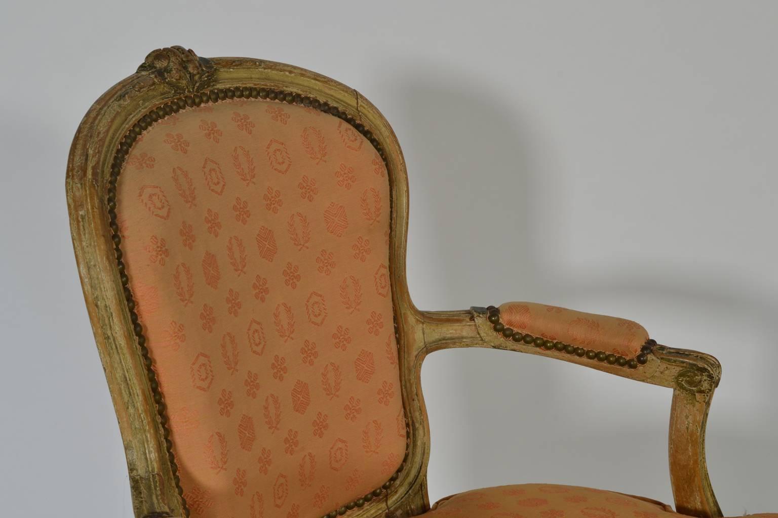 18th Century and Earlier Pair of Louis XV Carved and Crème Peinte Fauteuils For Sale