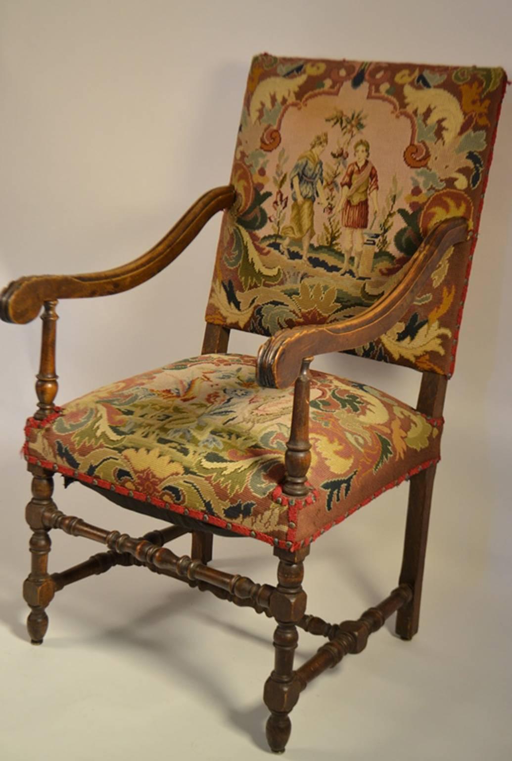 Louis XIII-style fruitwood fauteuil, late 19th century, the padded rectangular back joined to the like seat by downswept arms, raised on turned and block legs joined by like stretchers and ending in bulbous feet.