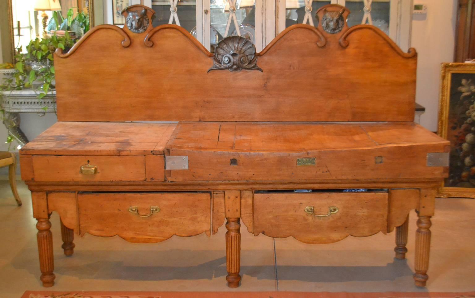 Long double Butcher Block Table in 7 Pieces. Circa 1890. Large piece has three drawers and one knife slot. Back piece has iron shell motif in center and two animal heads on each side.
A fabulous, authentic 19th century French billot de boucher or