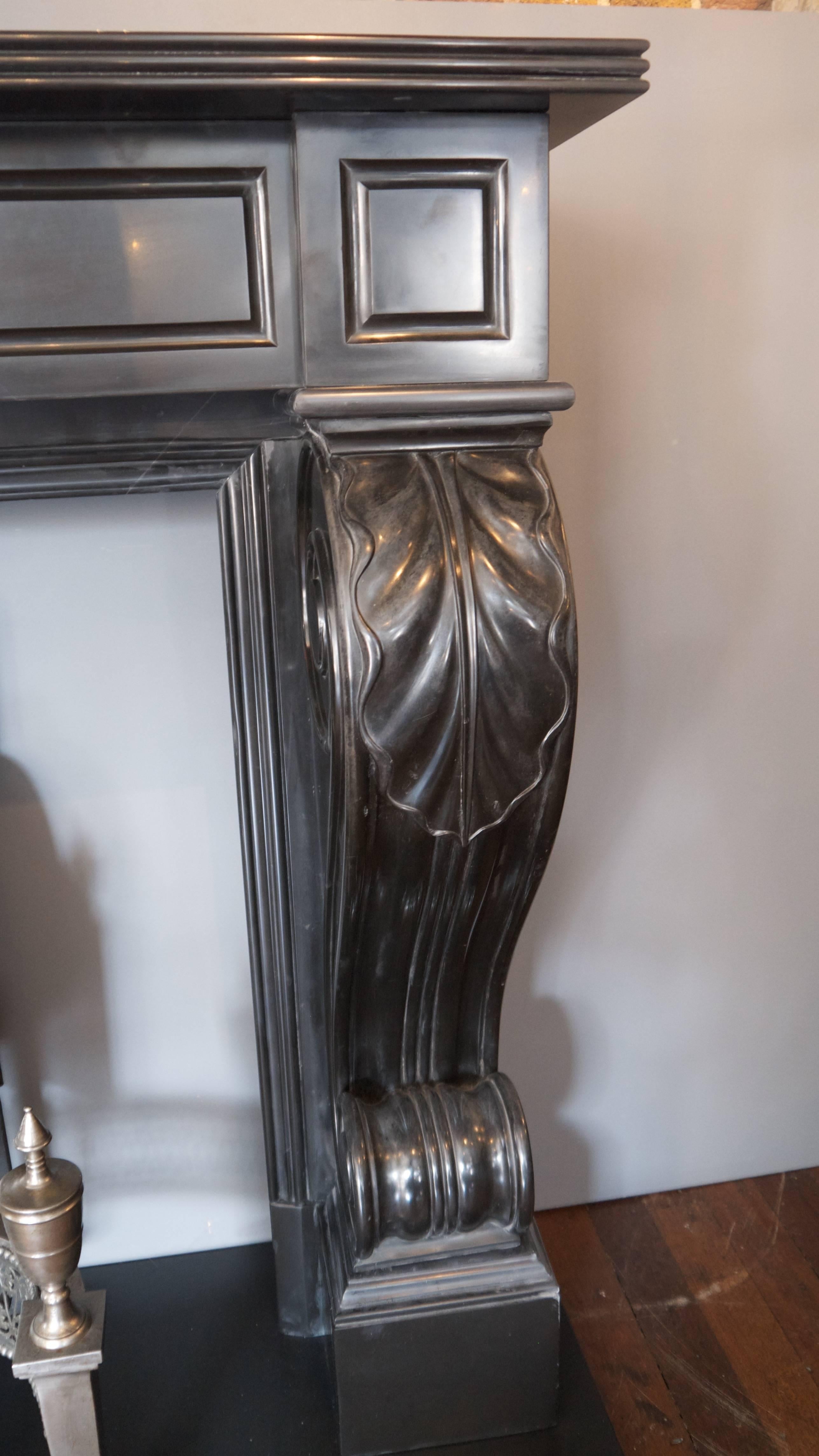 Early 19th century Regency neoclassical black marble surround. Opening 38 W x 31.75 H.