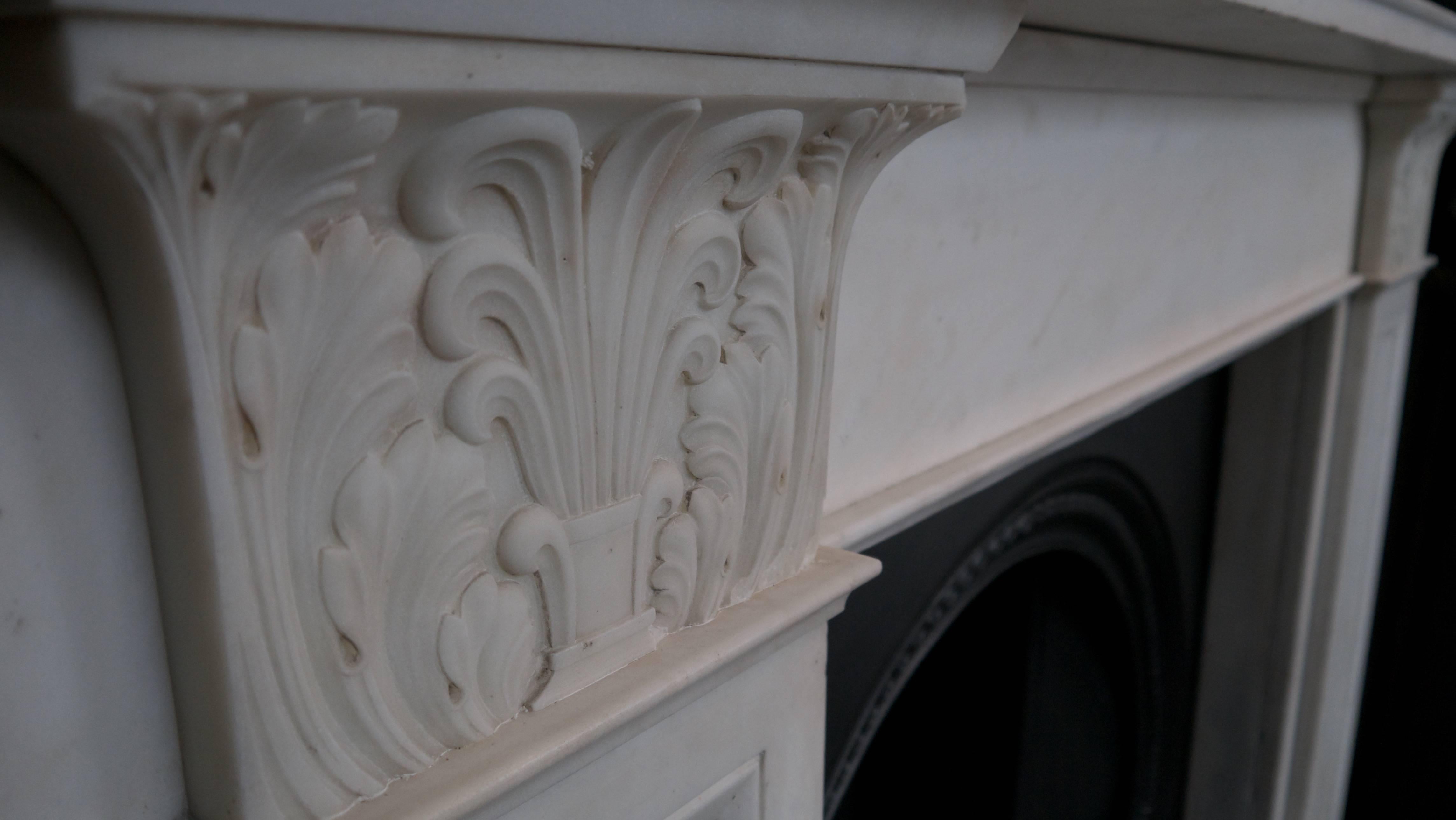 Original statuary white William IV marble surround featuring acanthus leaf and anthemion decoration and panelled legs. Opening 35