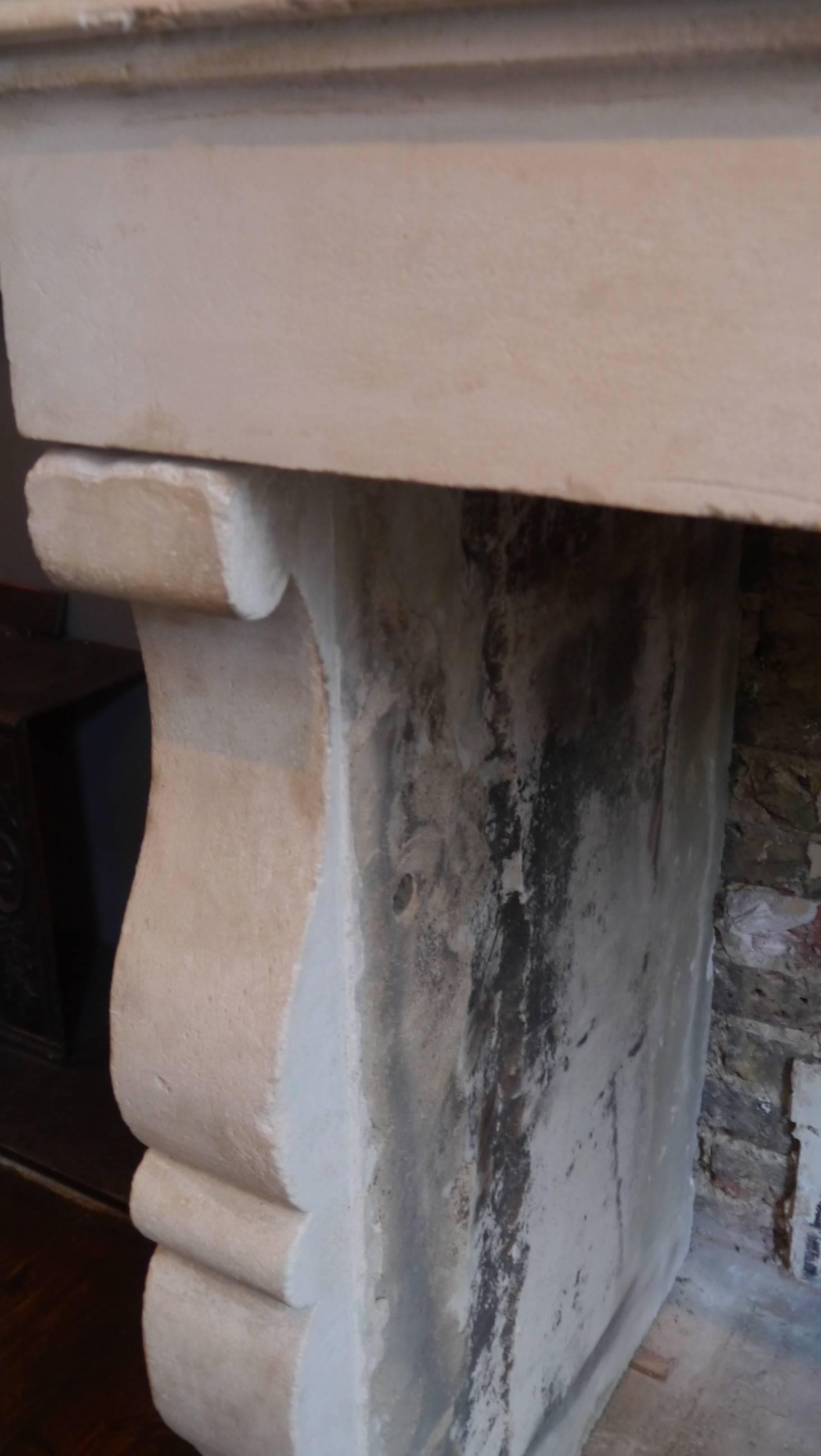 Antique 18th century en trumeau stone fireplace.