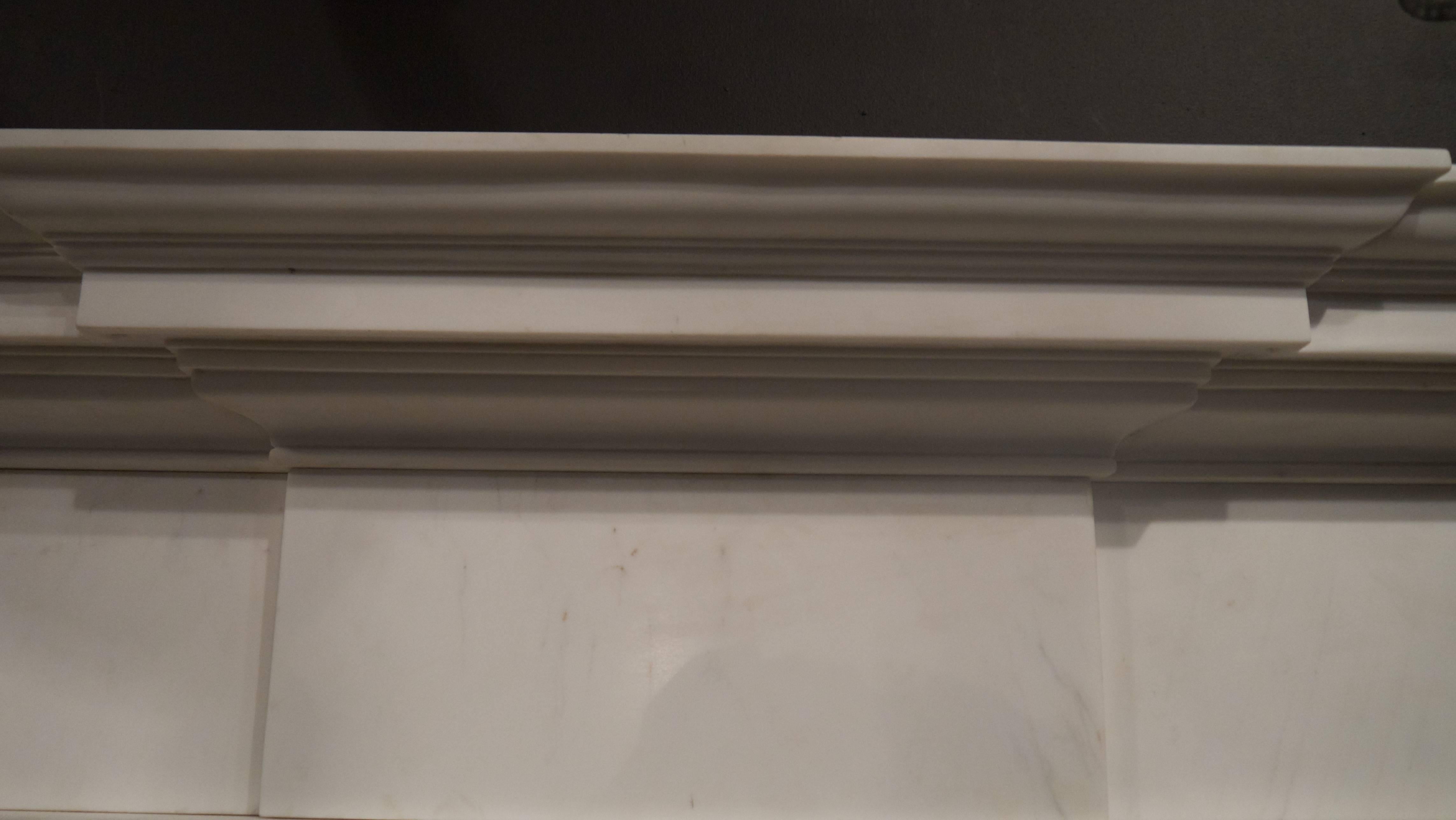 Reproduction statuary white Georgian style marble fireplace. One of a pair. Opening measures 40 x 40.