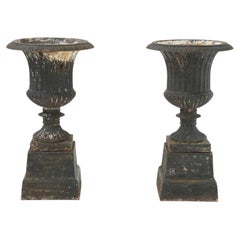Pair of Late Victorian Cast Iron Urns, presenting a classic Campana silhouette