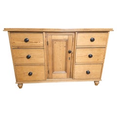 A Victorian English waxed pine dresser base or server w/ 6 drawers
